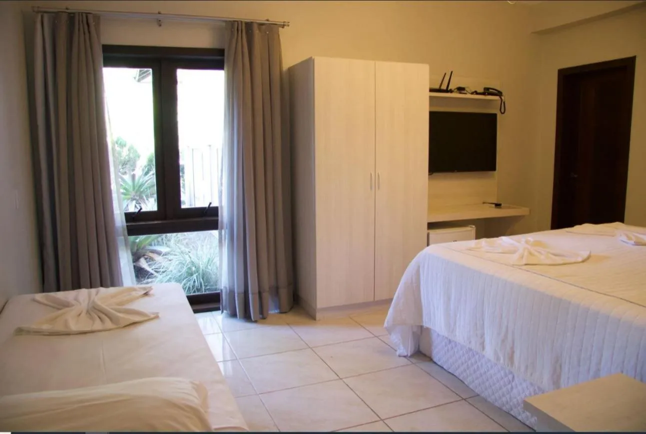 Bed in Pousada Casarão Gastehaus