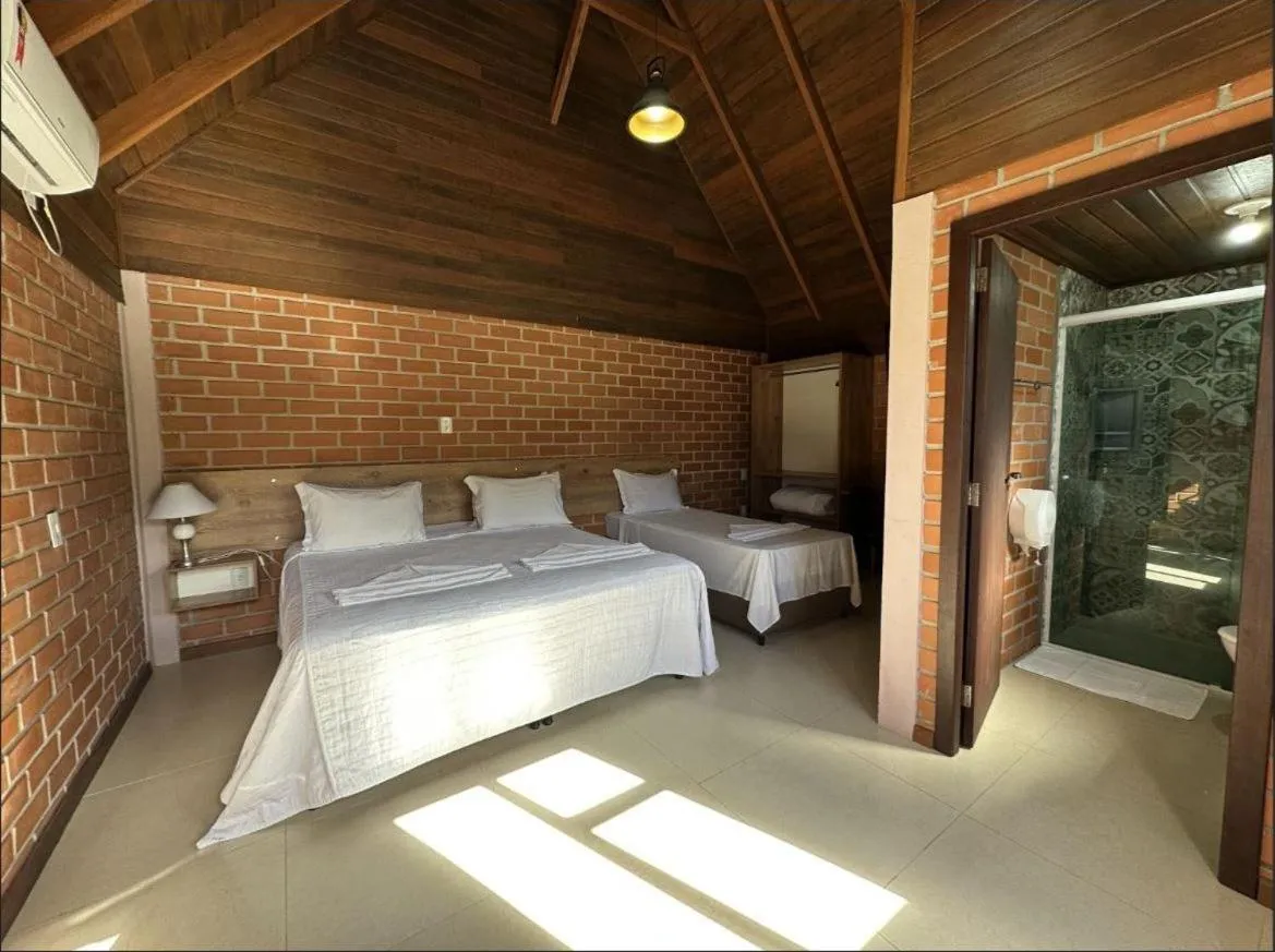 Bed in Pousada Casarão Gastehaus