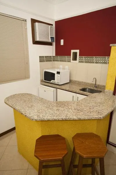 Kitchen or kitchenette in Raio do Sol Residence