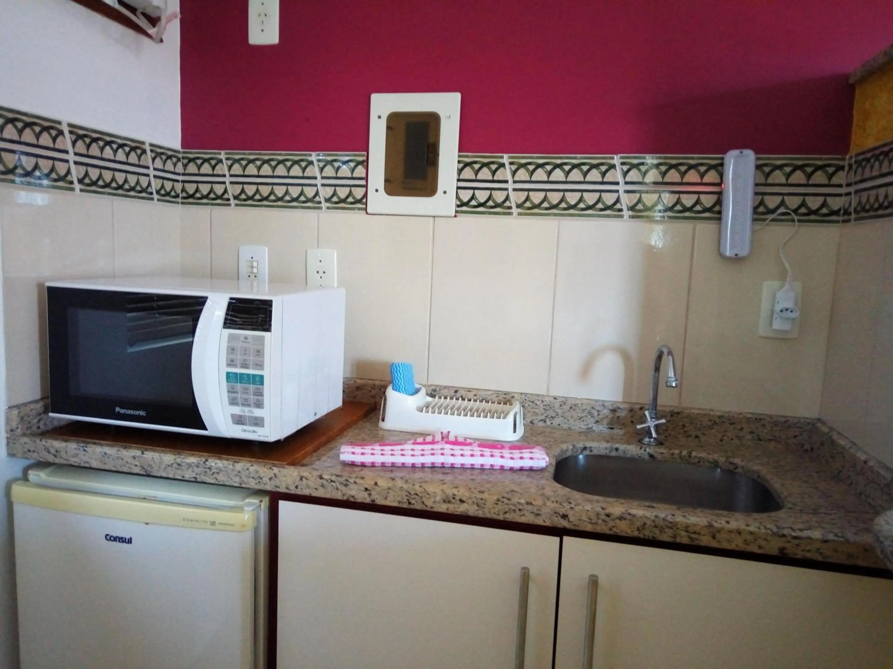 Kitchen or kitchenette in Raio do Sol Residence