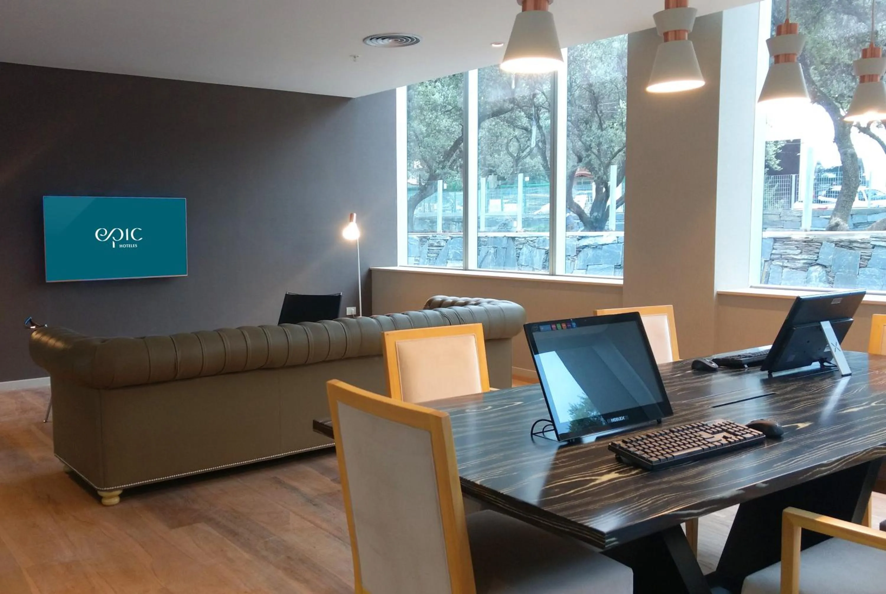 Communal lounge/ TV room in Epic Hotel Villa de Merlo