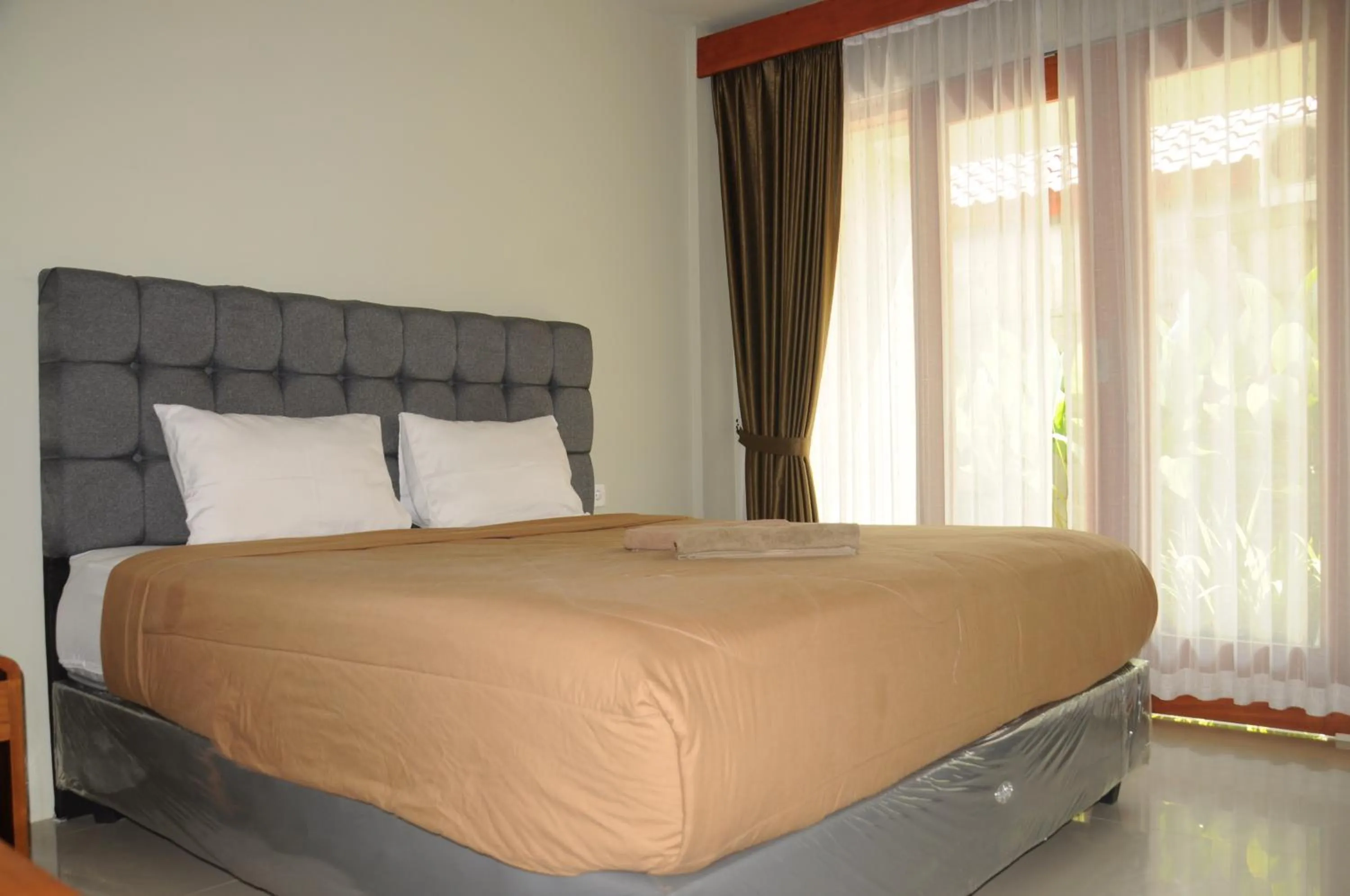 Bed in Hastina Hotel Lombok