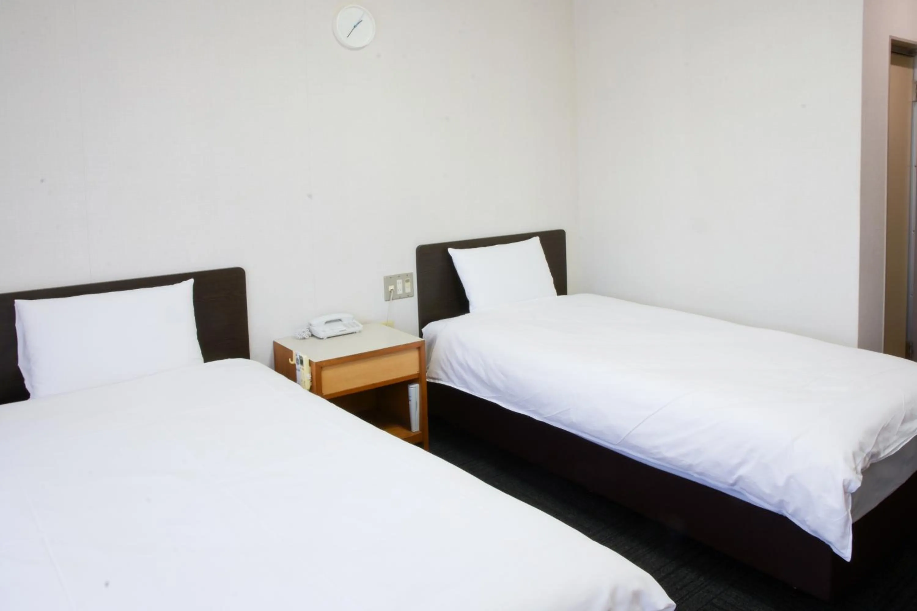 Bed in Toyokawa Grand Hotel