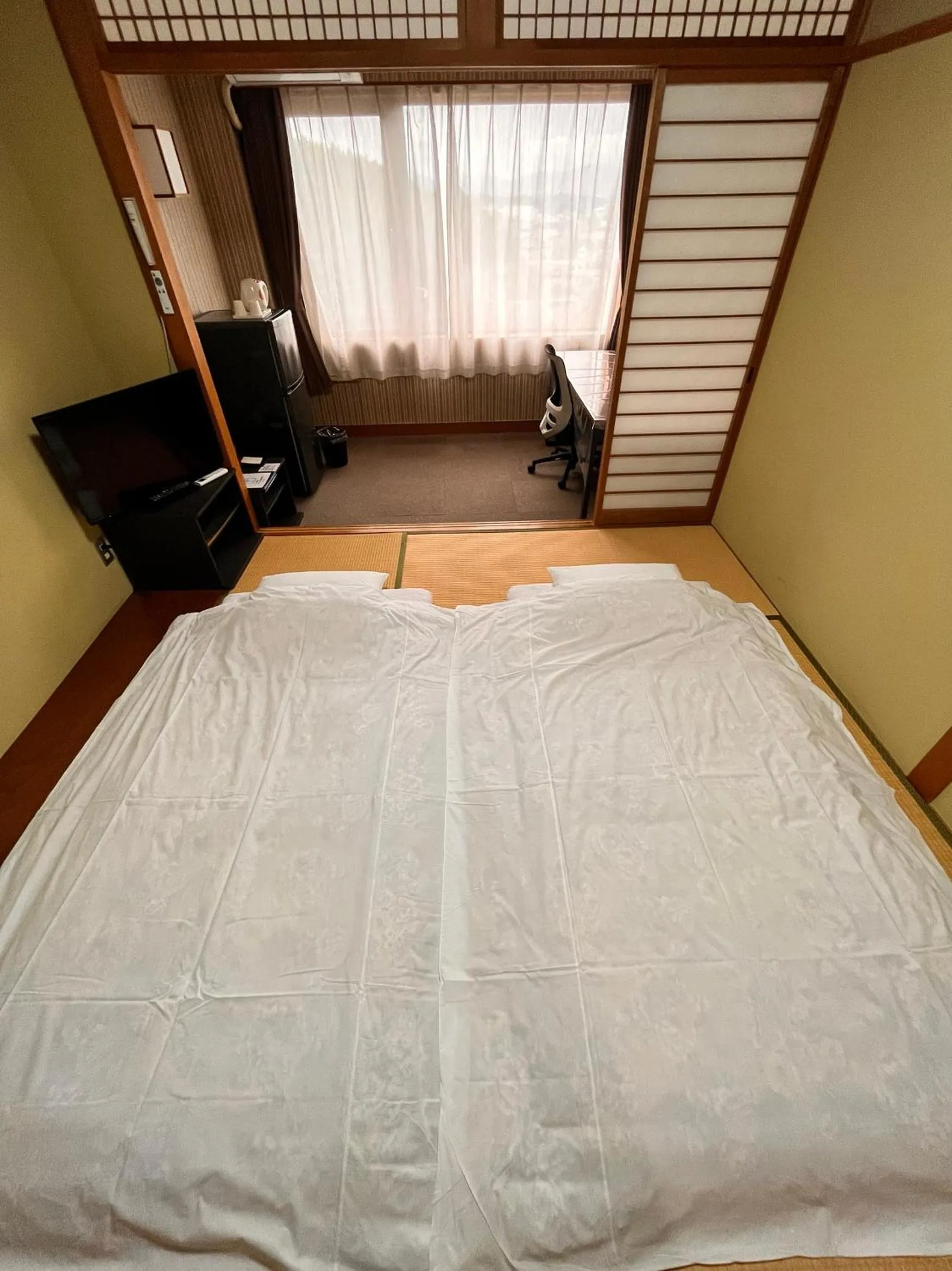 Bed in Toyokawa Grand Hotel