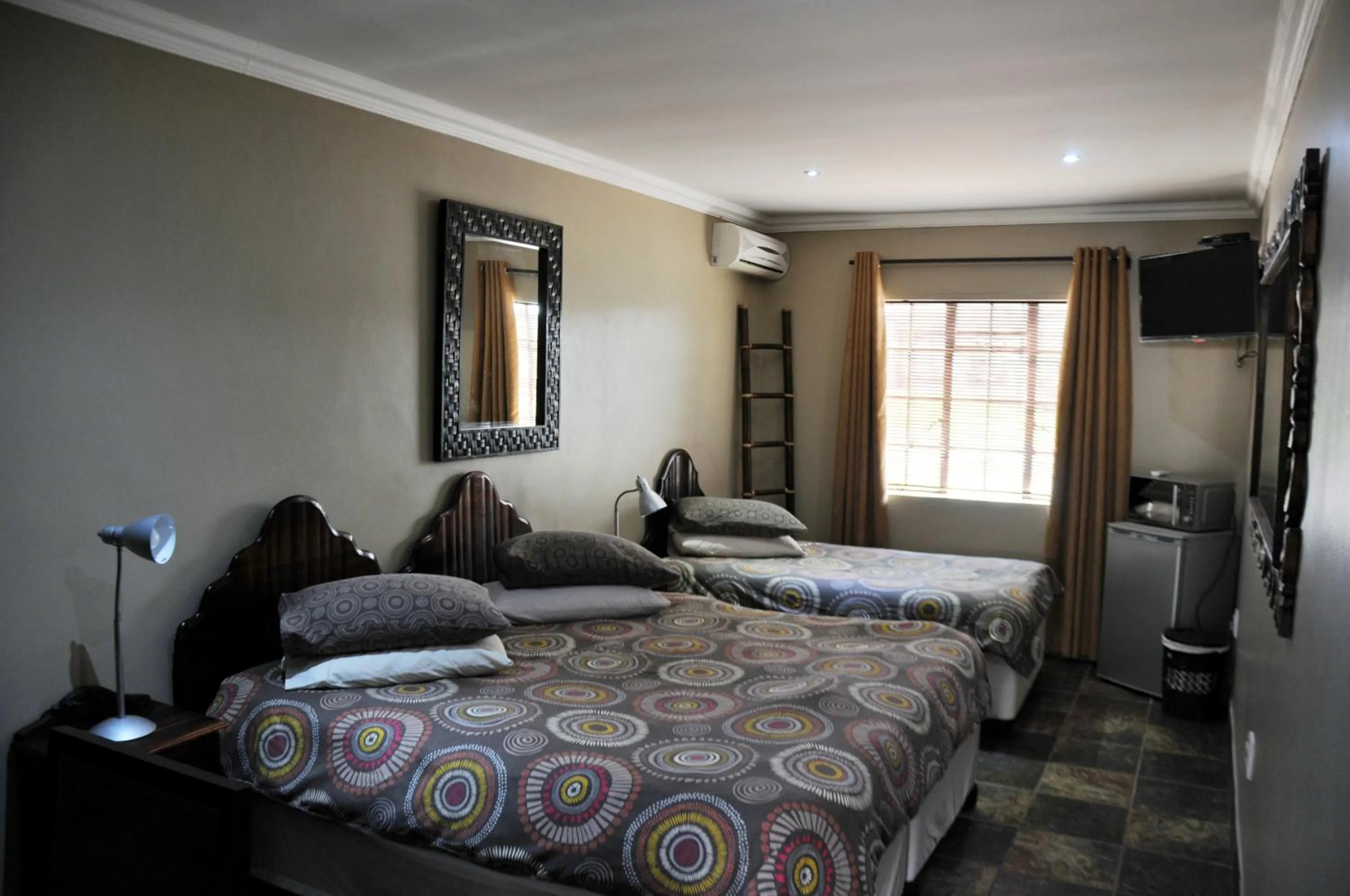 Bed in Mi Casa Guest House