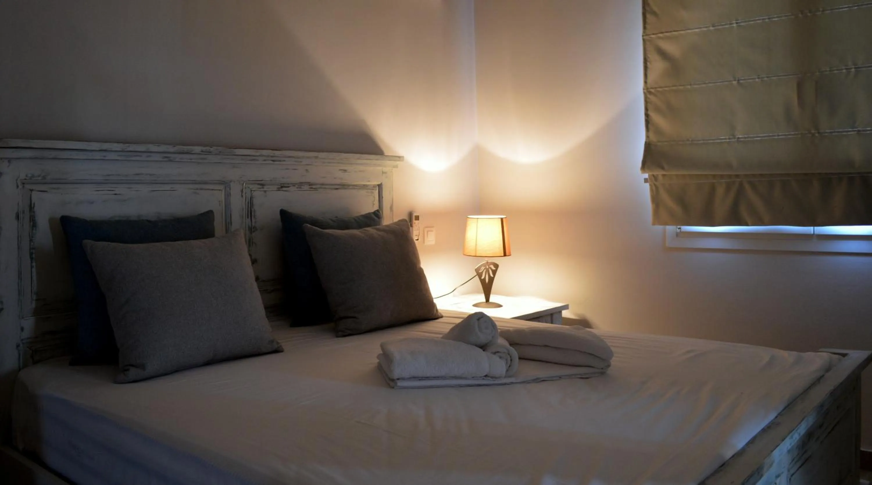 Bed in Ammos Luxury Suites