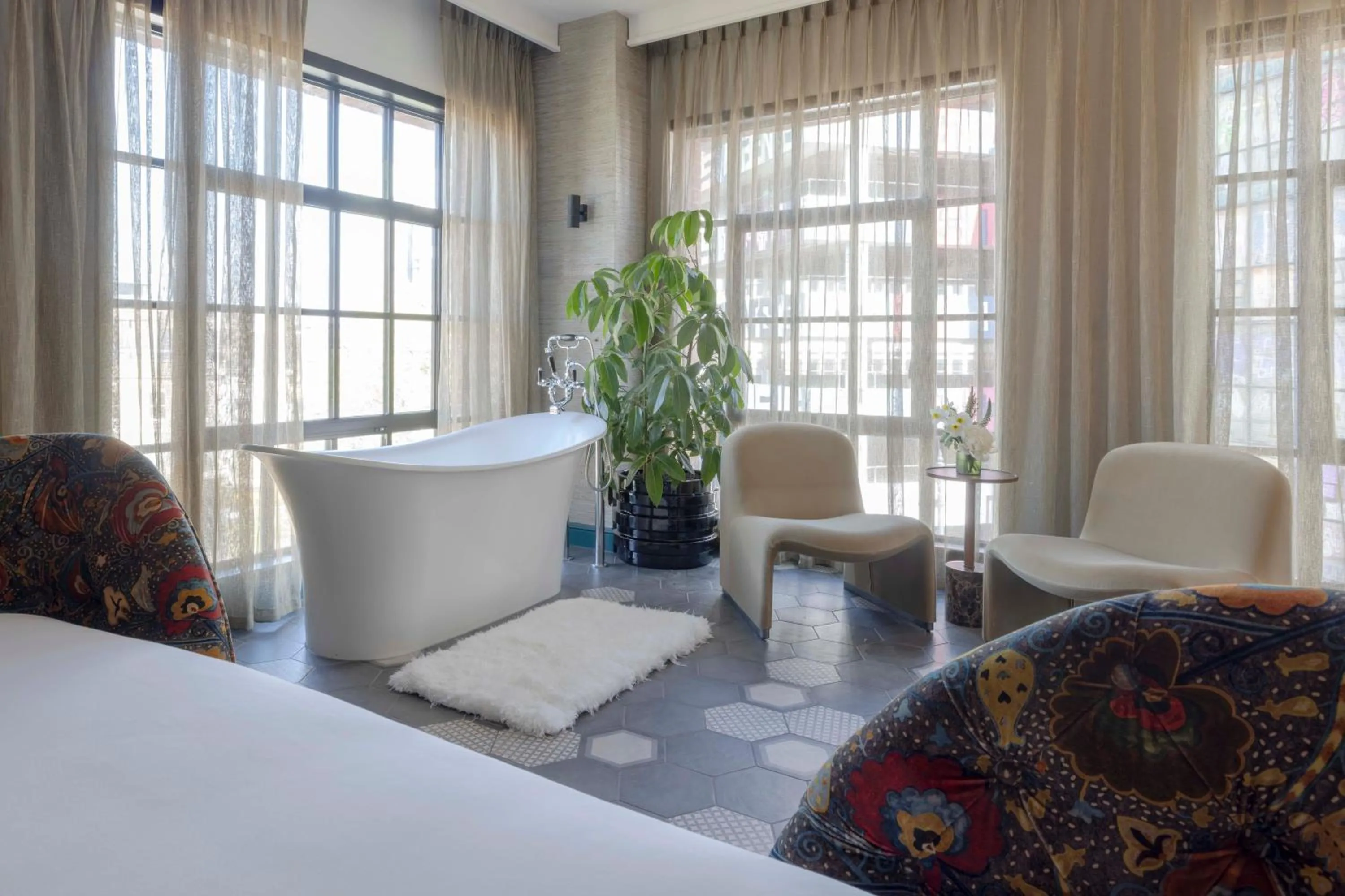 Seating area, Bed in Virgin Hotels London - Shoreditch