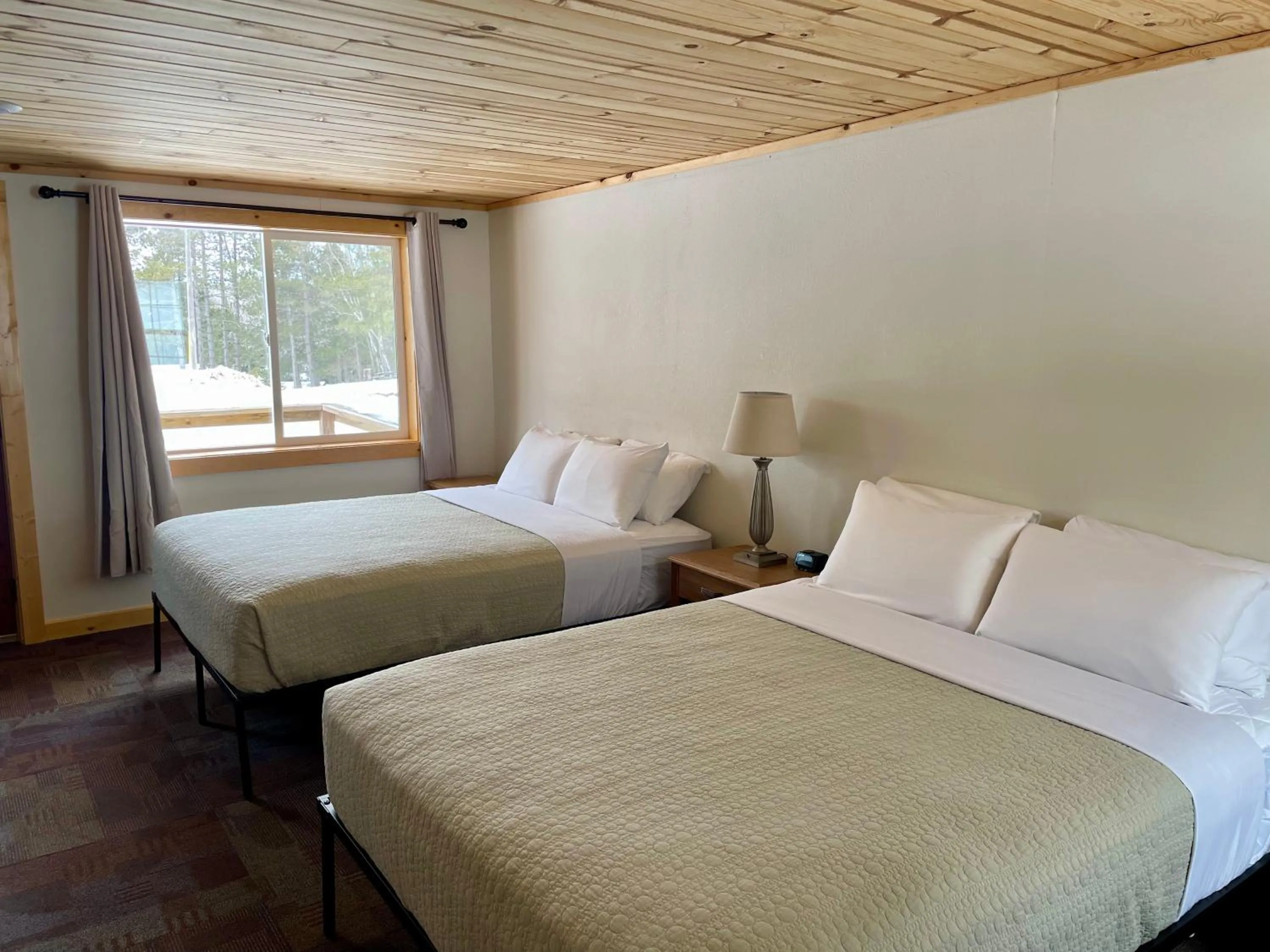 Bed in Hanging Horn Lakeside Resort