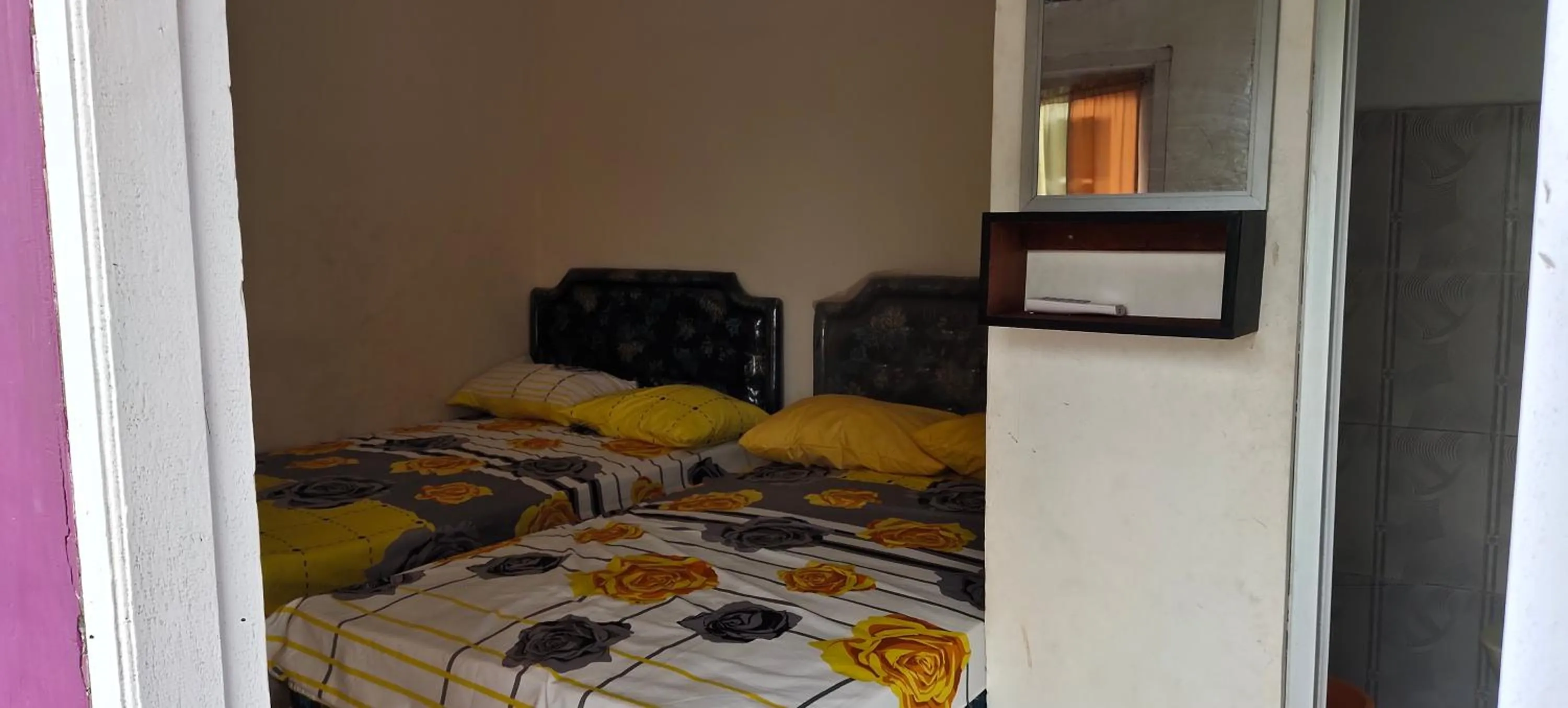 Bed in Penginapan Karanglaut Sayangheulang