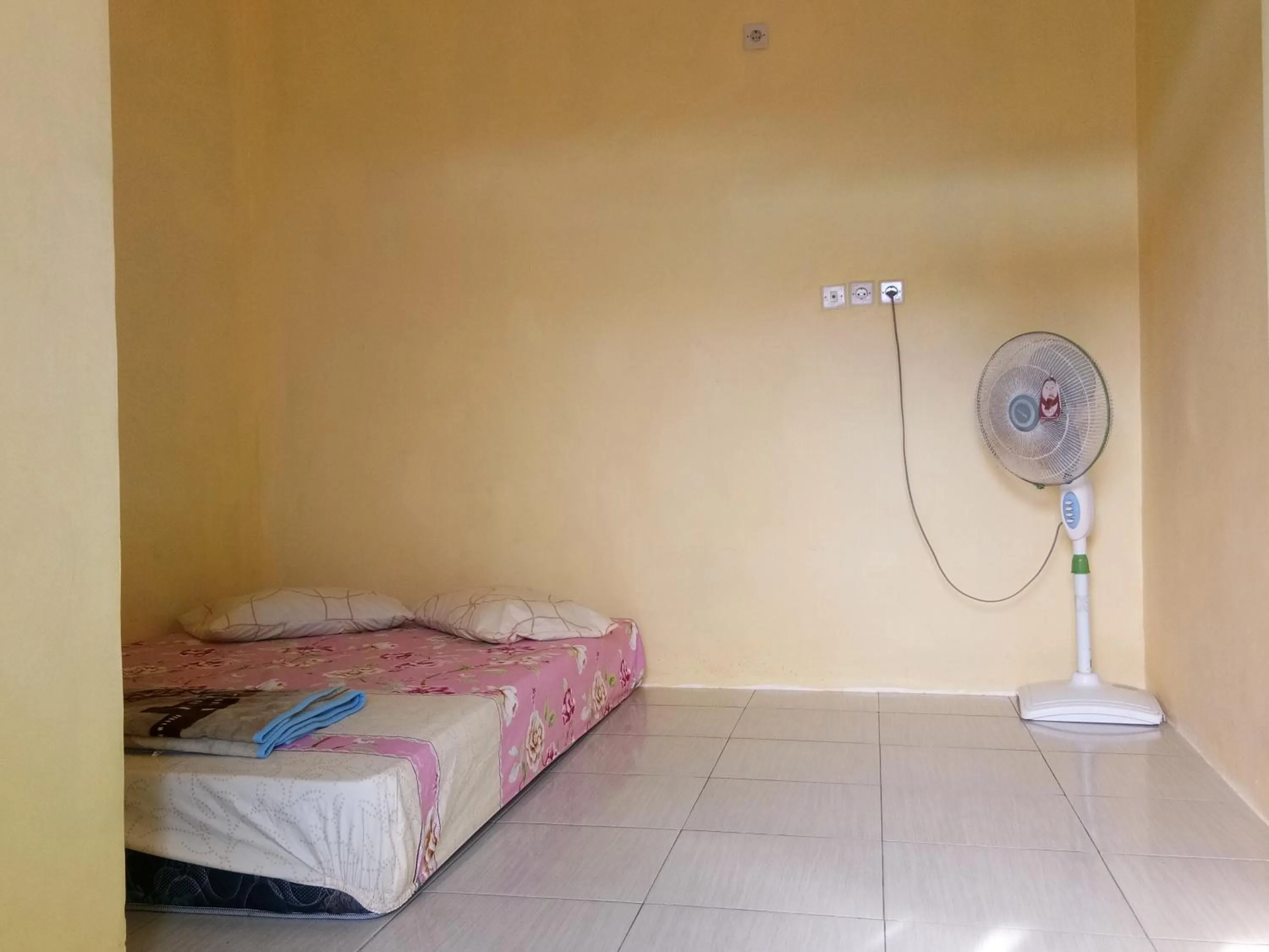 Bed in Penginapan Karanglaut Sayangheulang