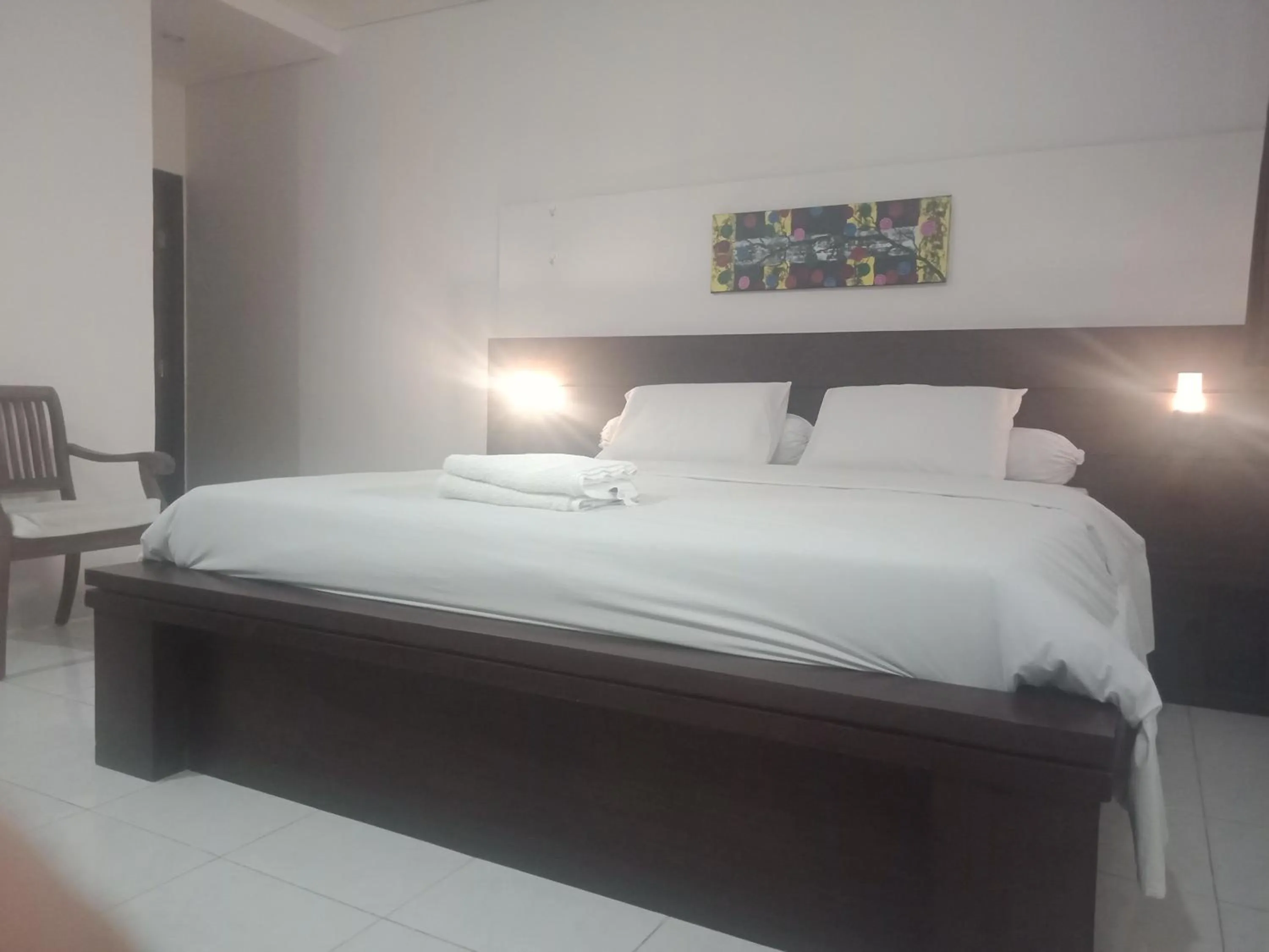 Bed in D'puja Home Stay and Spa