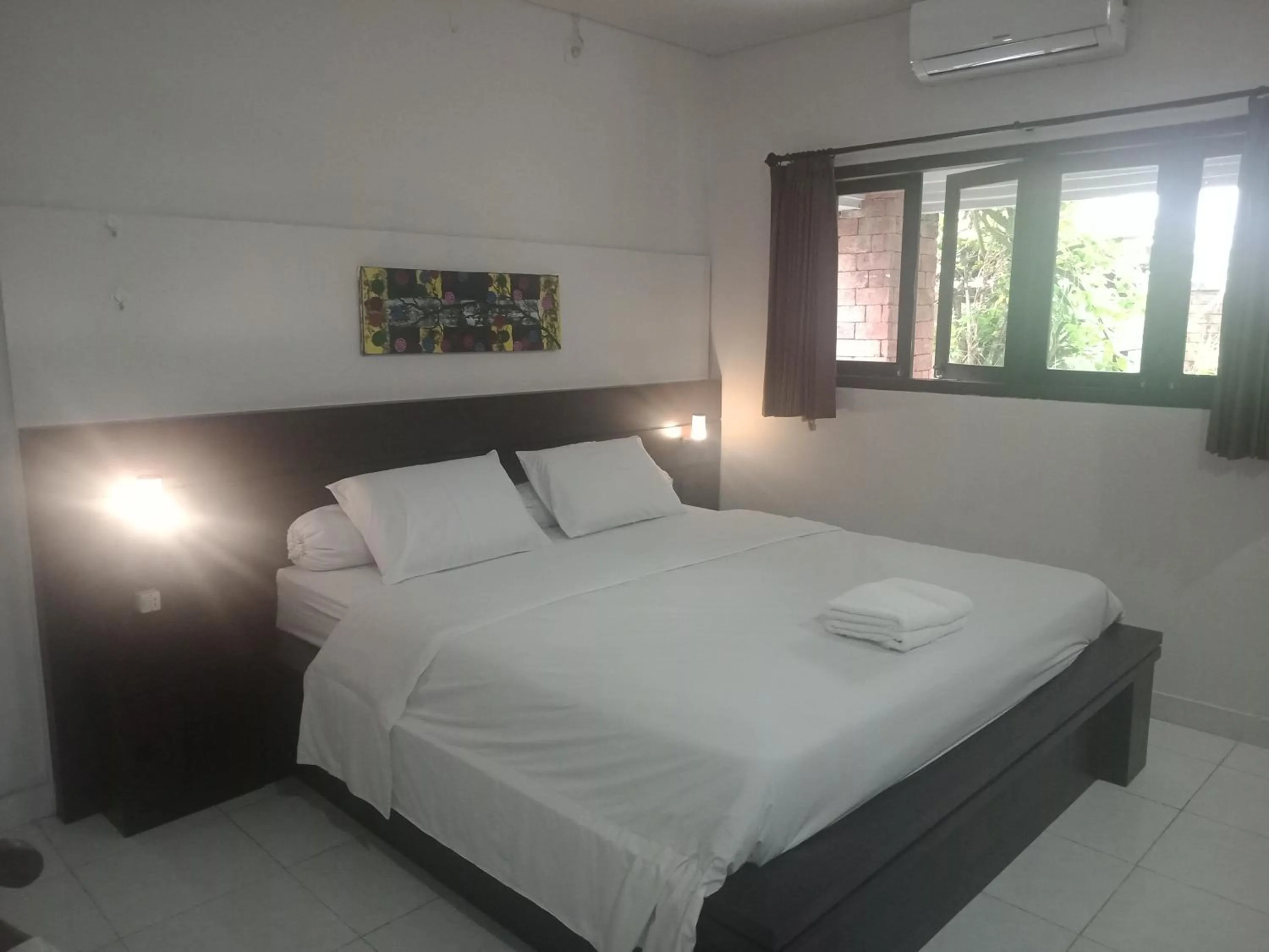 Bed in D'puja Home Stay and Spa