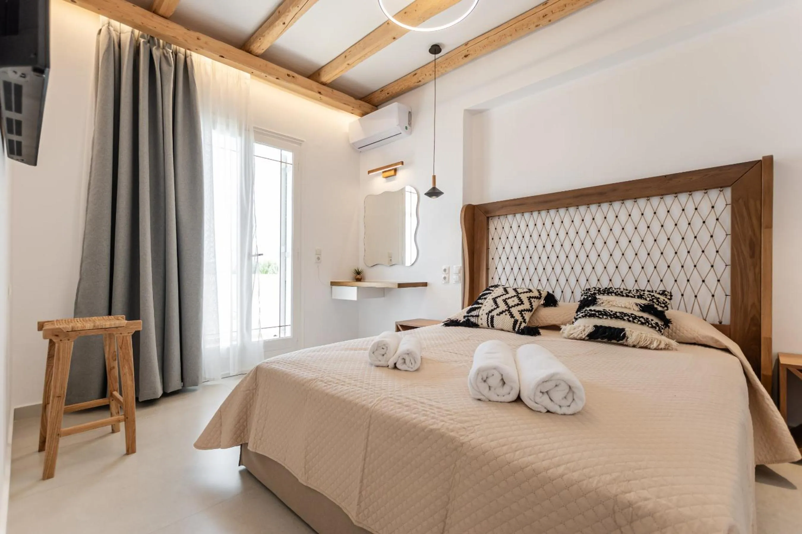 Bed in Birikos Hotel & Suites