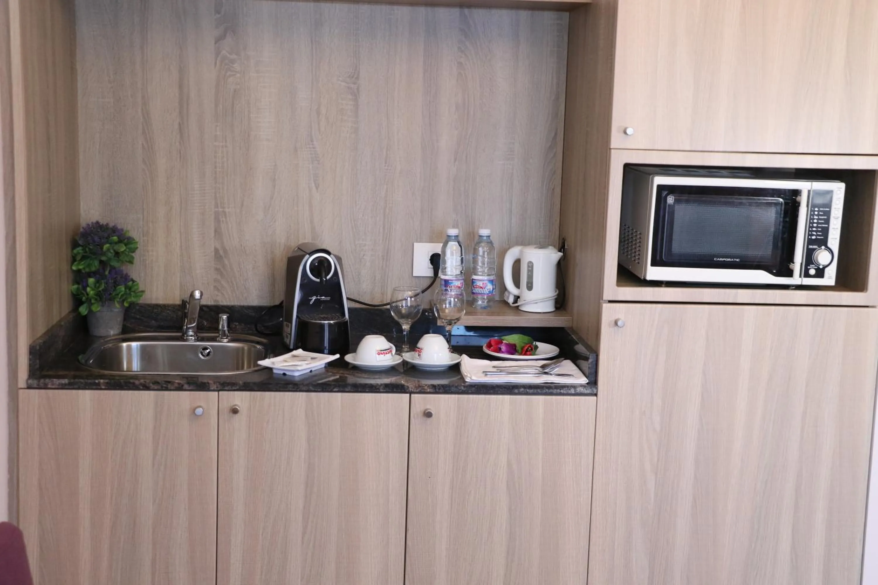 Kitchen or kitchenette in HOtello guest suites
