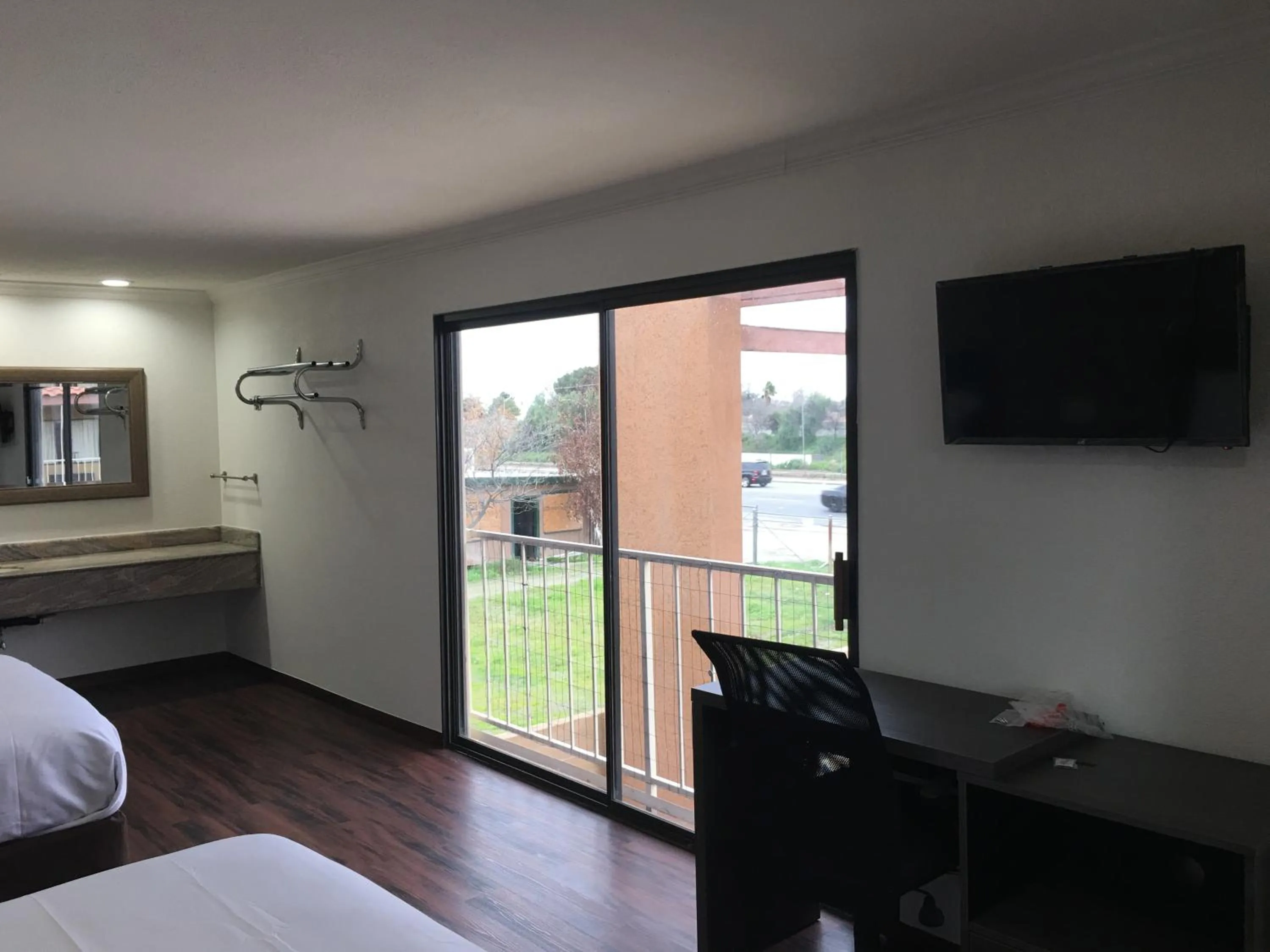 Pool view, Bed in Baymont by Wyndham Bakersfield