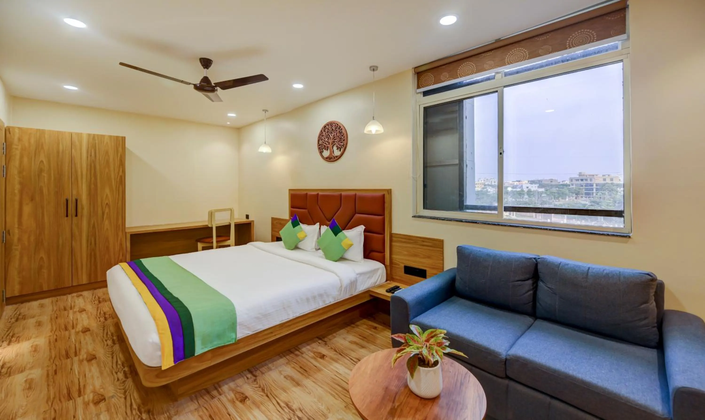 Seating area, Bed in Treebo Aasma Downtown