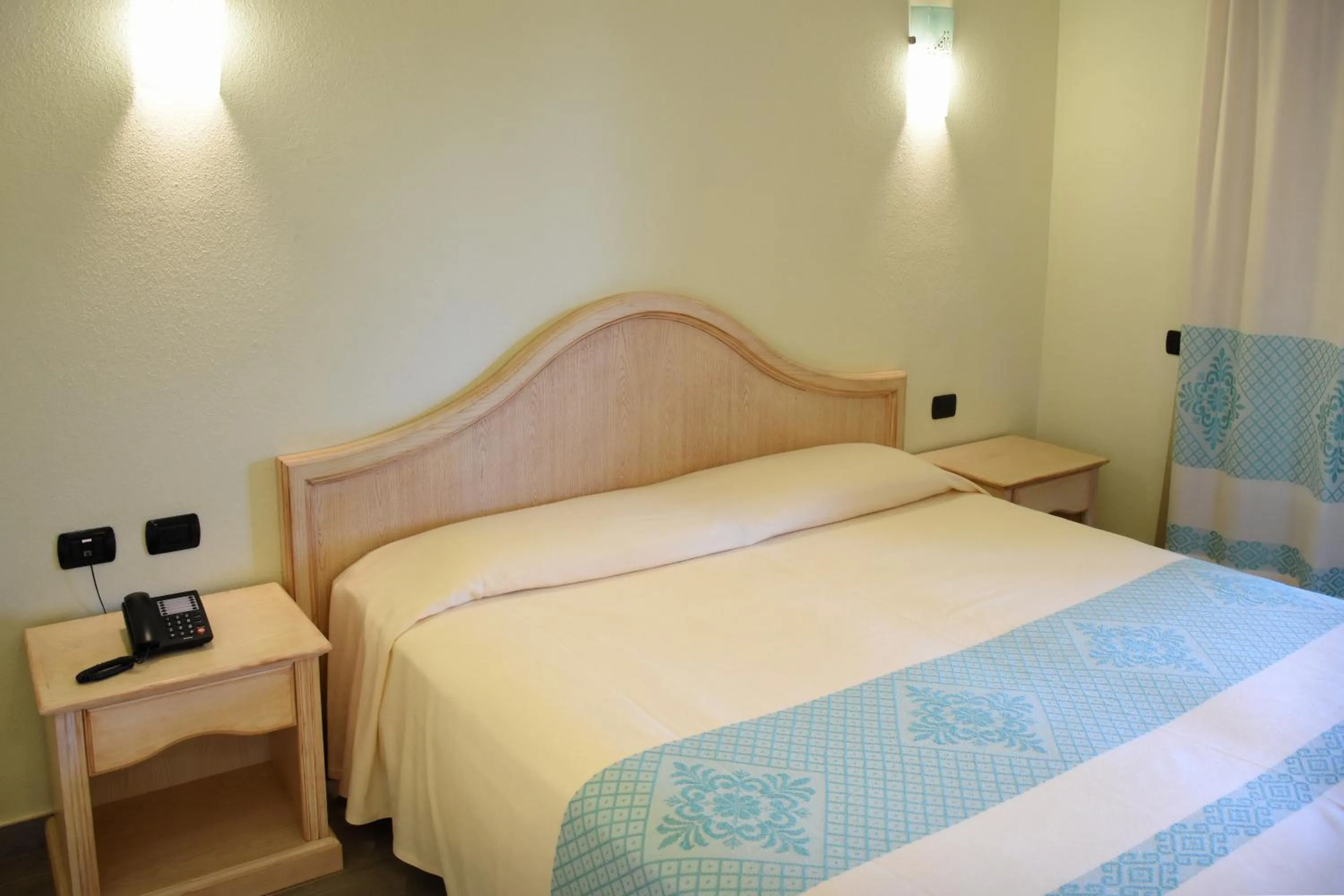 Bed in Hotel Su Giganti