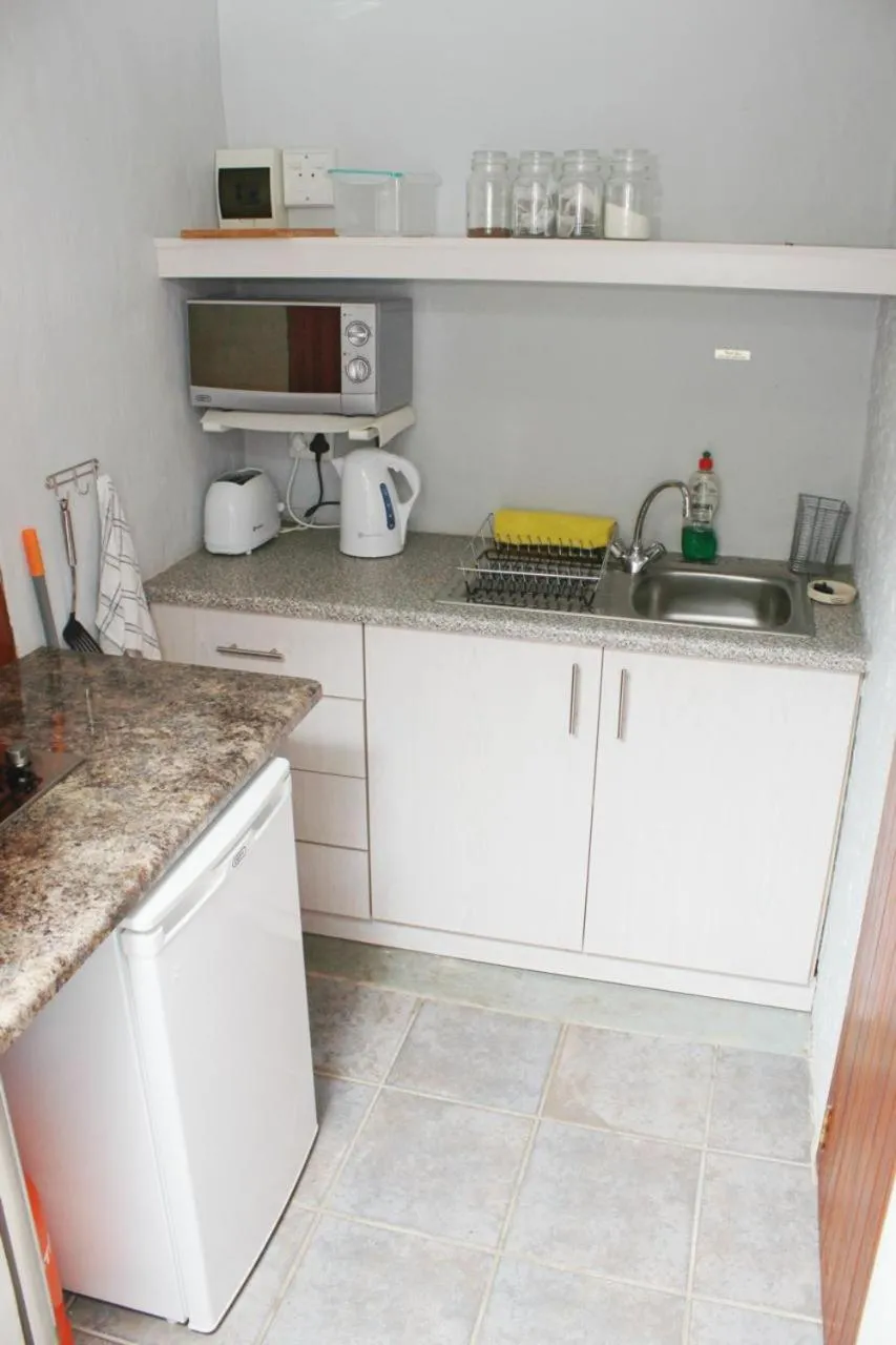 Kitchen or kitchenette in At One Lodge