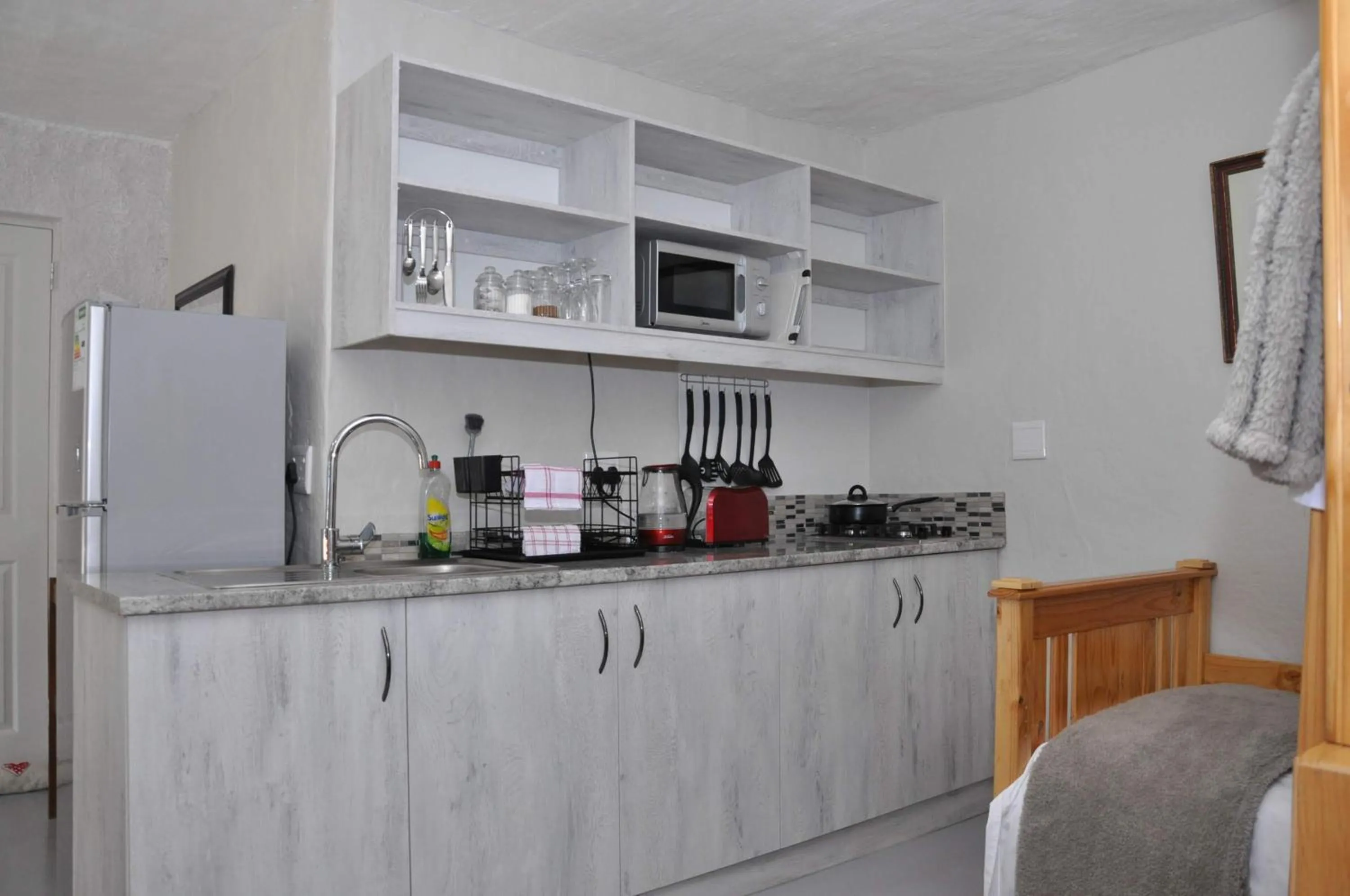 Kitchen or kitchenette in At One Lodge