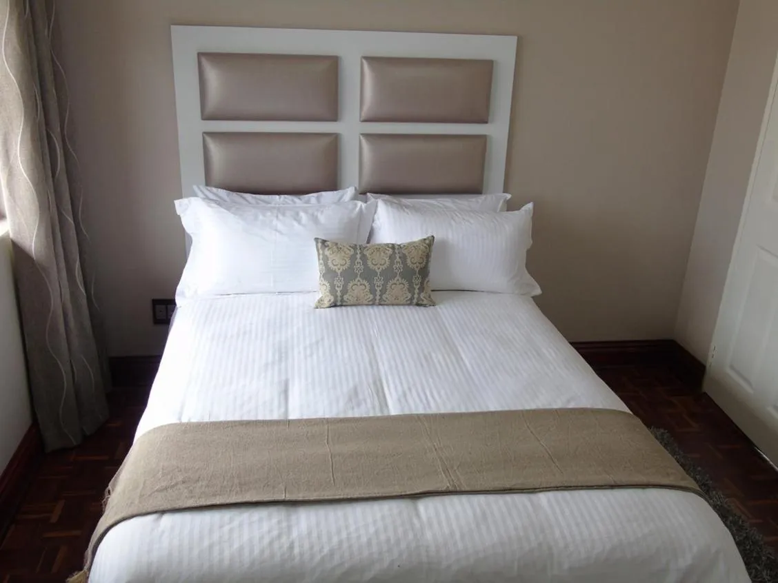 Bed in The Musafer Travel Lodge