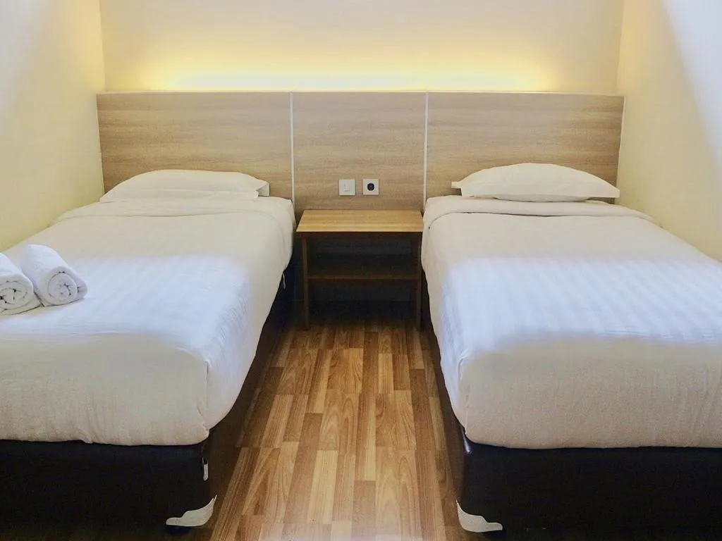 Bed in Mutiara Suites
