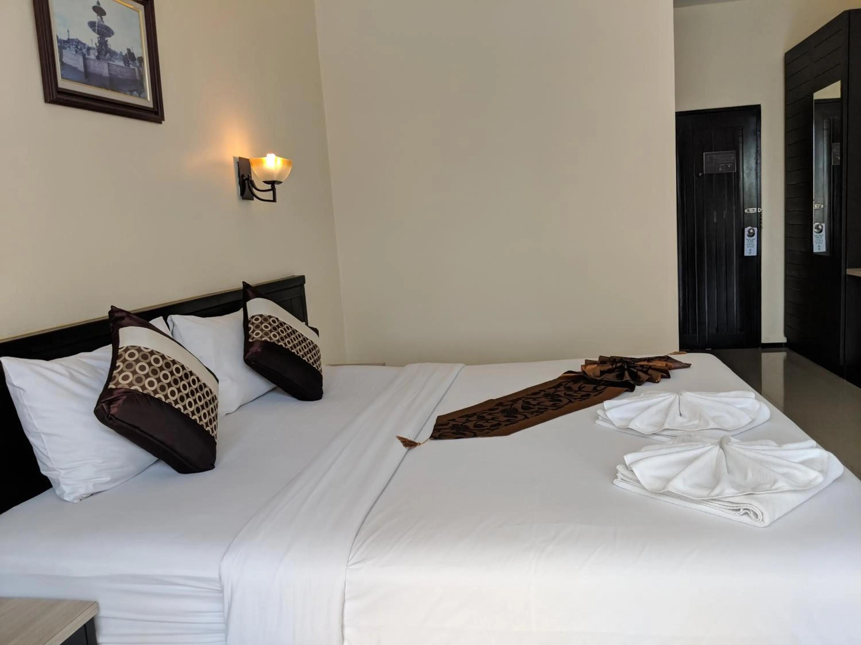 Bed in Kanokan Hotel