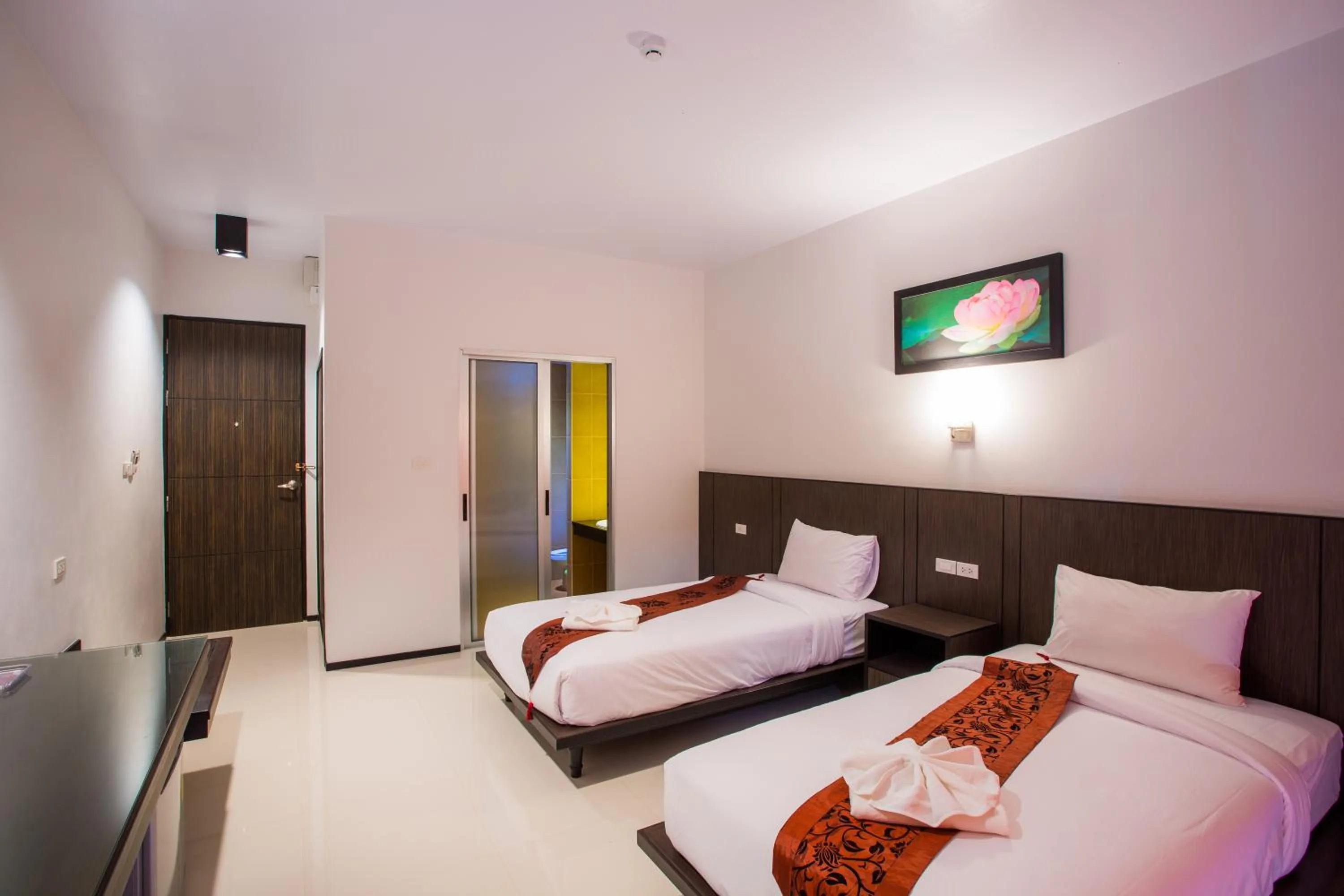 Bed in Kanokan Hotel