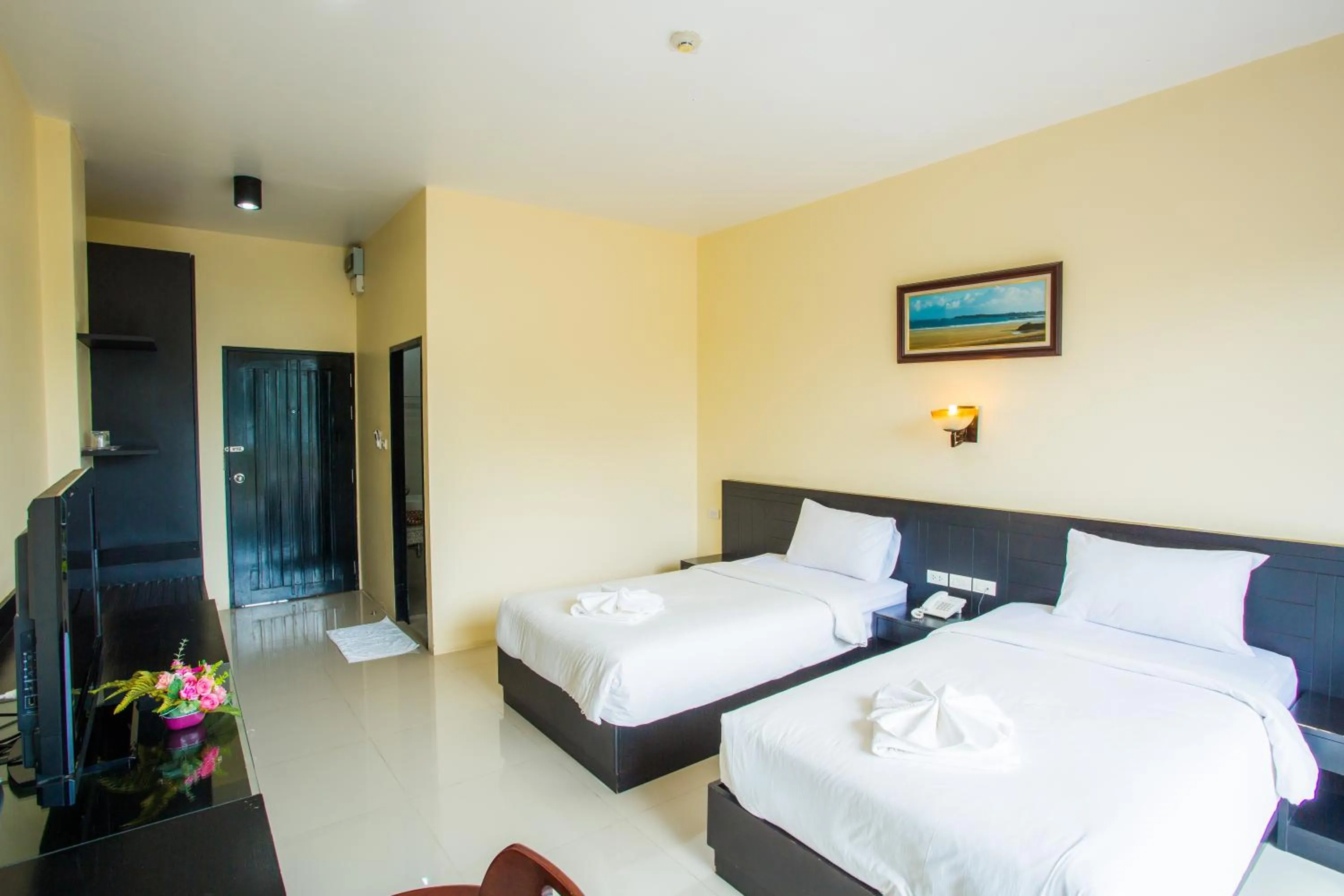 Bed in Kanokan Hotel