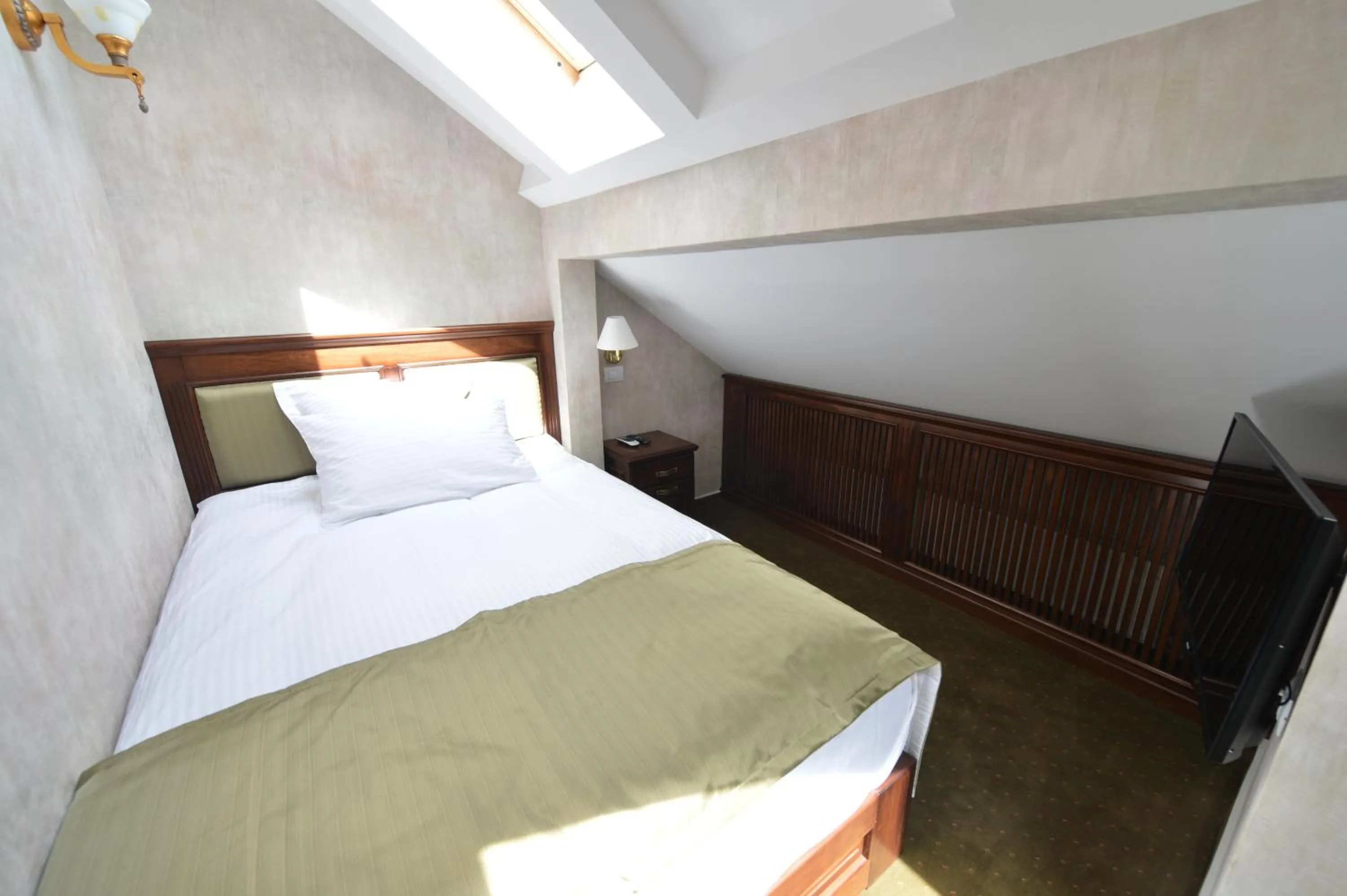 Bed in Noblesse Boutique Resort