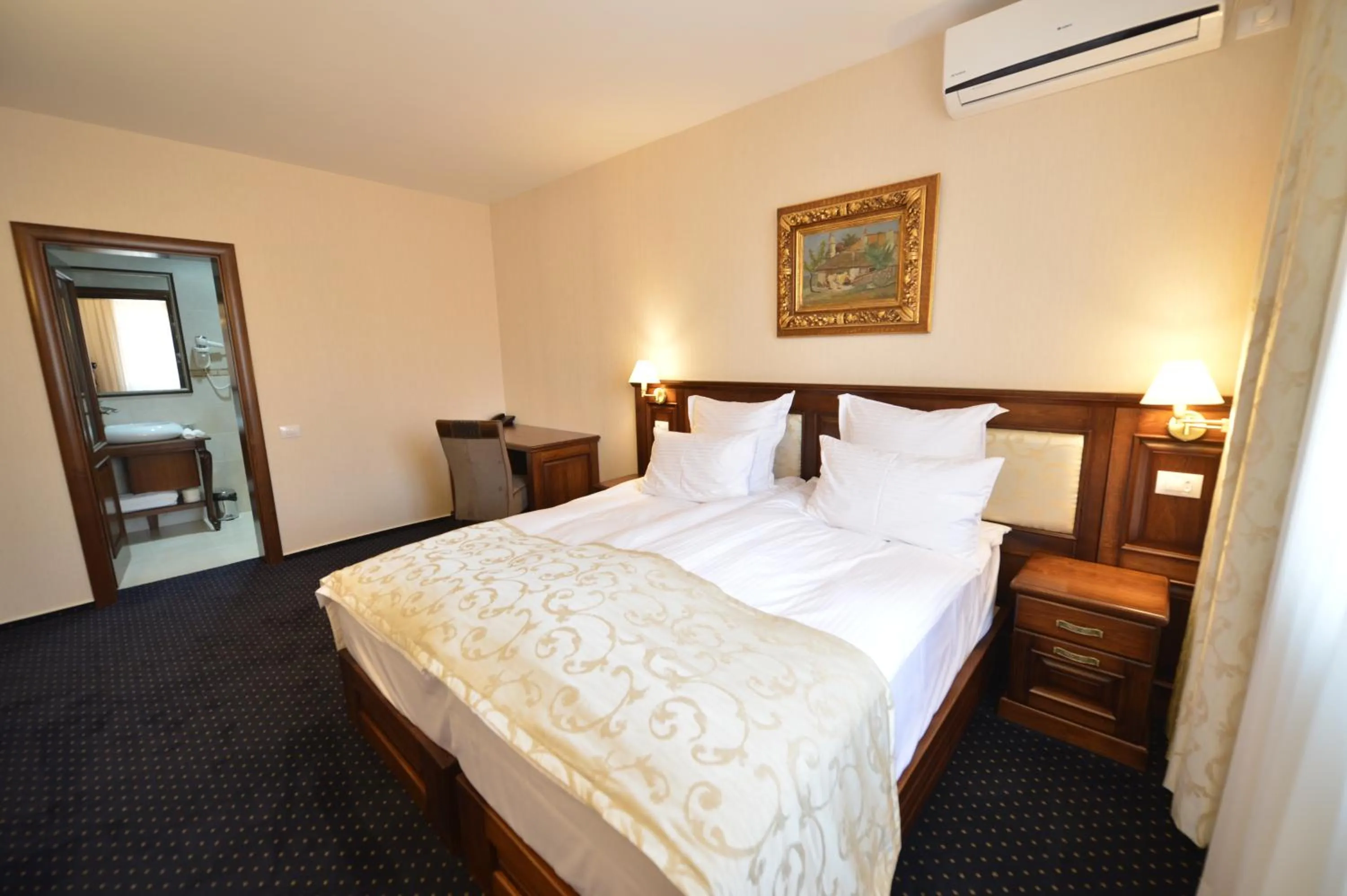 Bed in Noblesse Boutique Resort