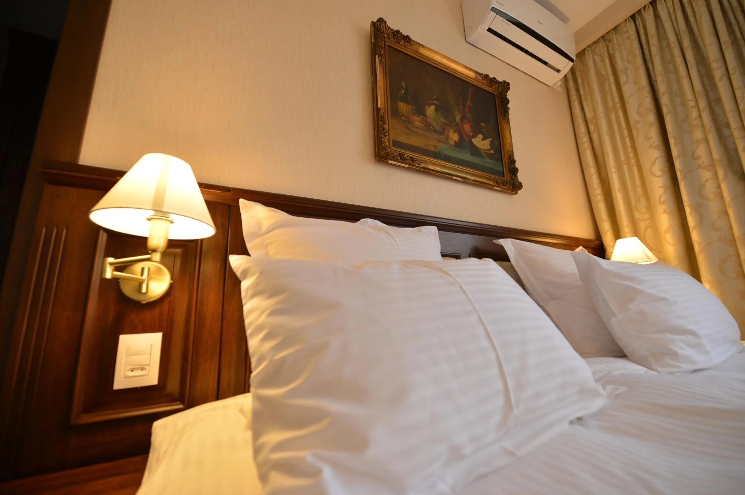 Bed in Noblesse Boutique Resort