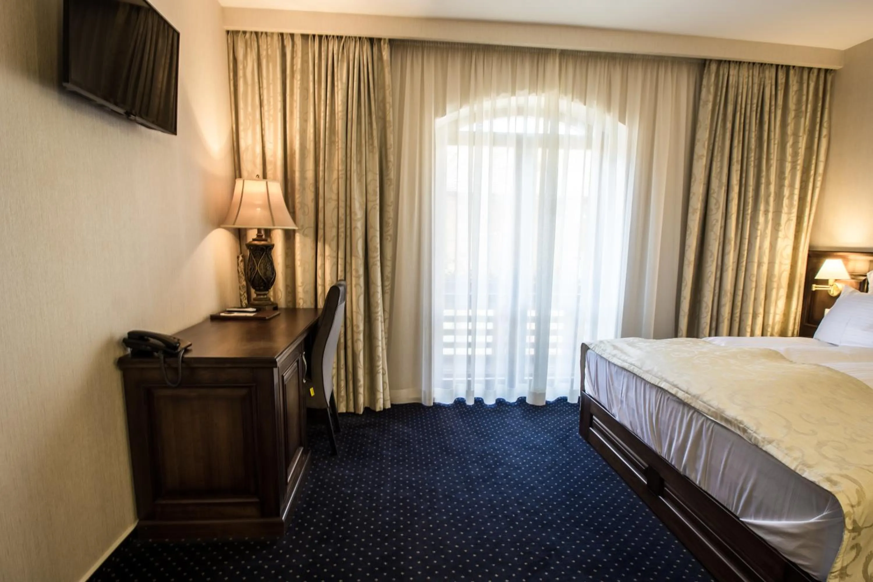 Bed in Noblesse Boutique Resort