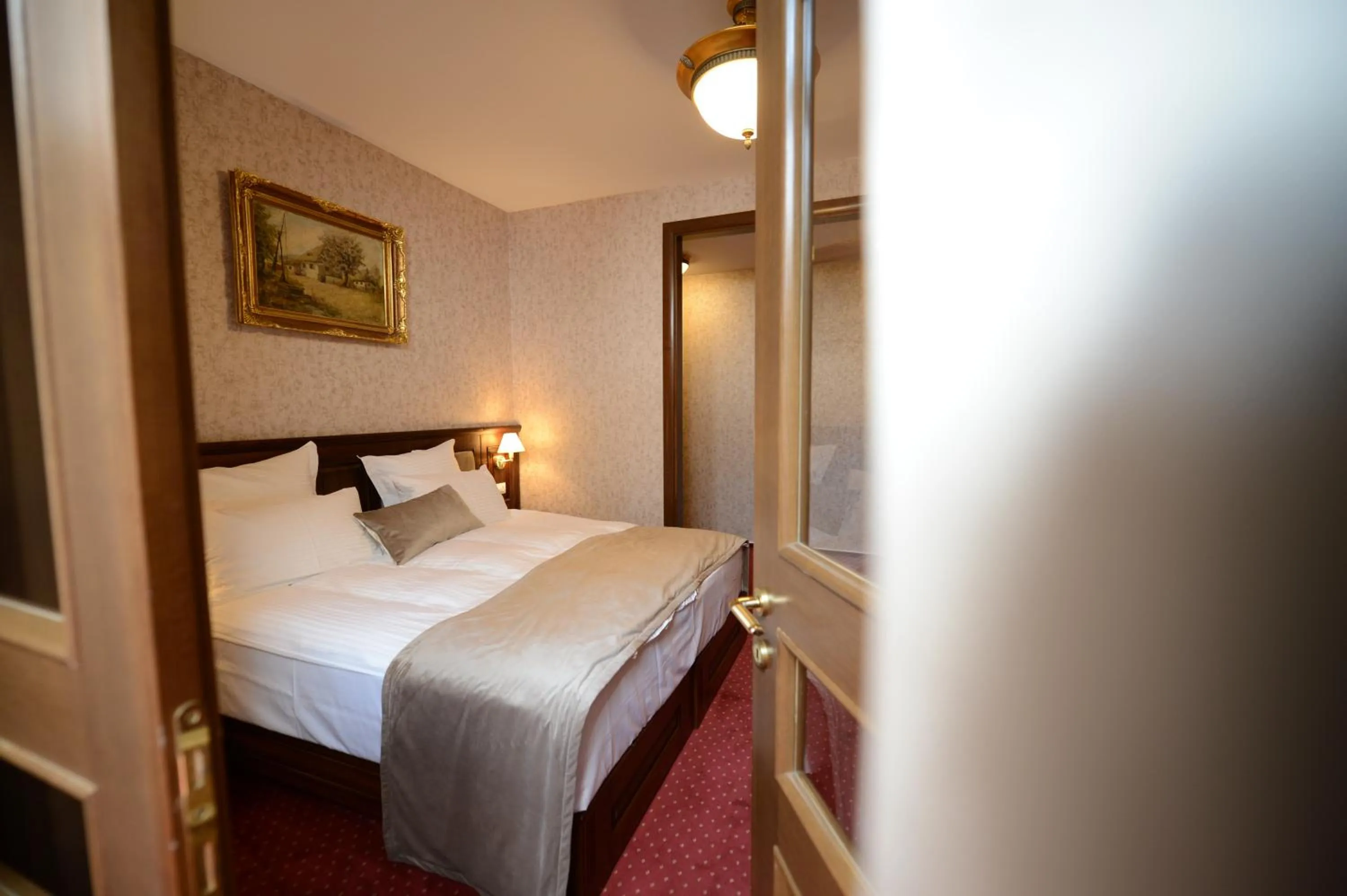 Bed in Noblesse Boutique Resort