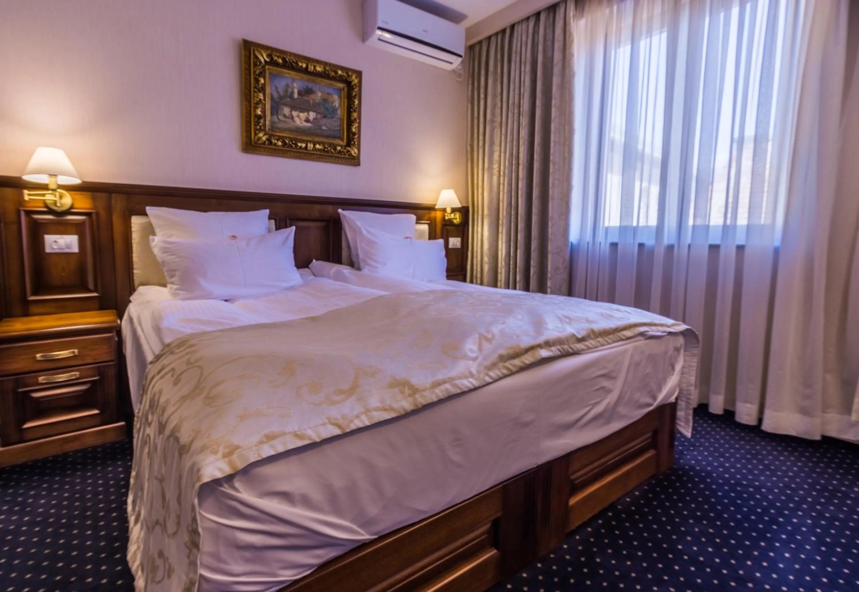 Bed in Noblesse Boutique Resort