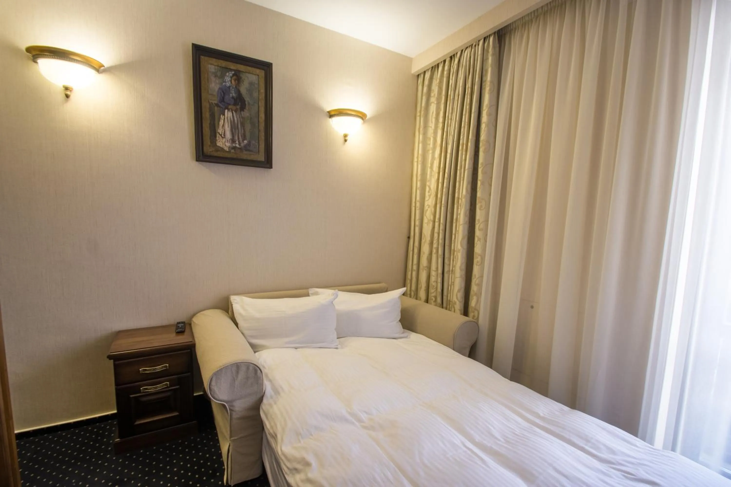 Bed in Noblesse Boutique Resort