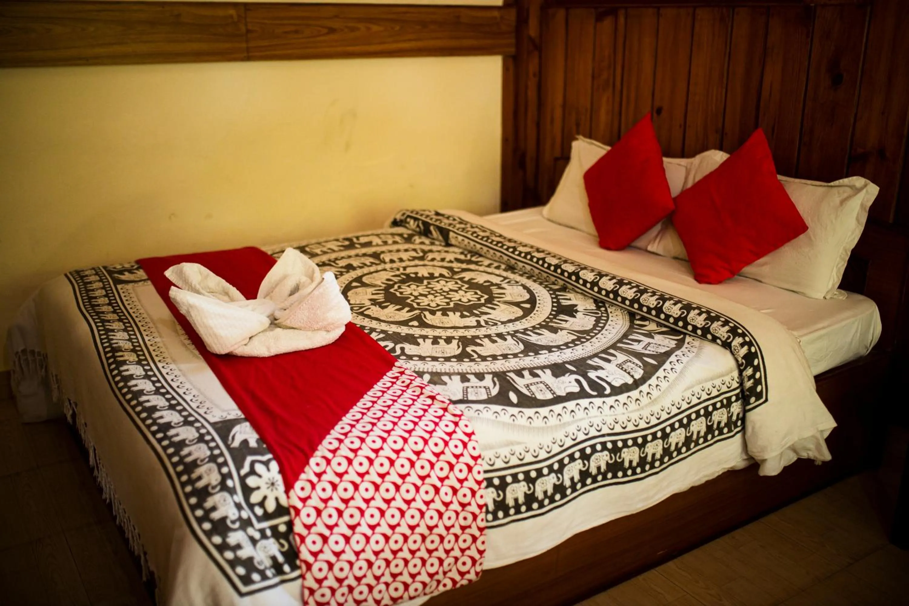 Bed in Chitwan Riverside Resort