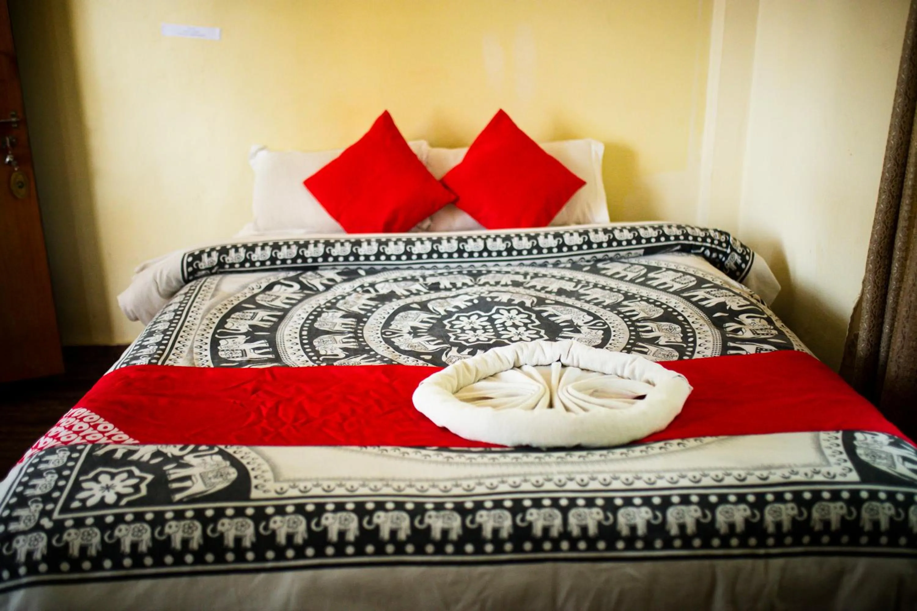 Bed in Chitwan Riverside Resort