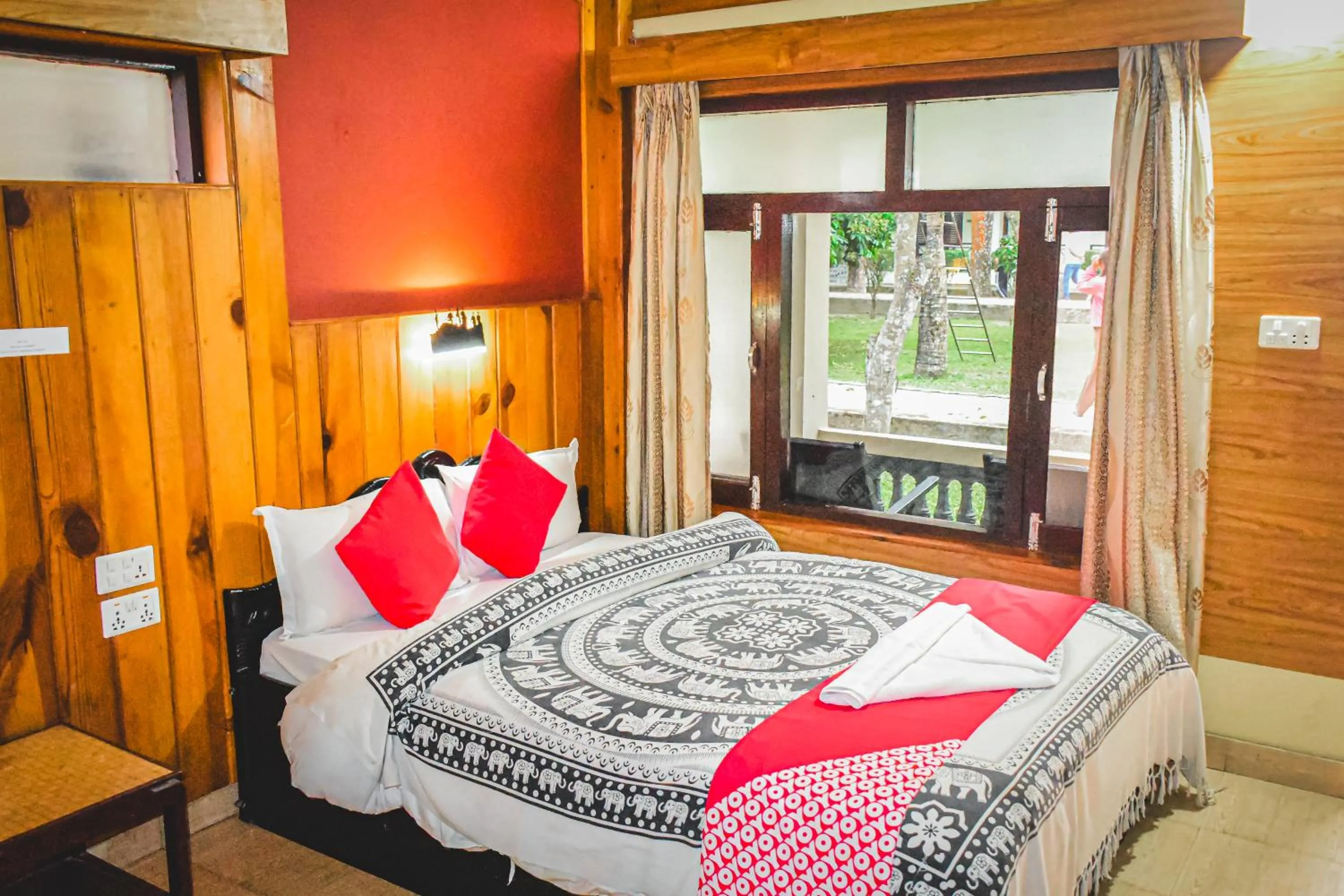 Bed in Chitwan Riverside Resort