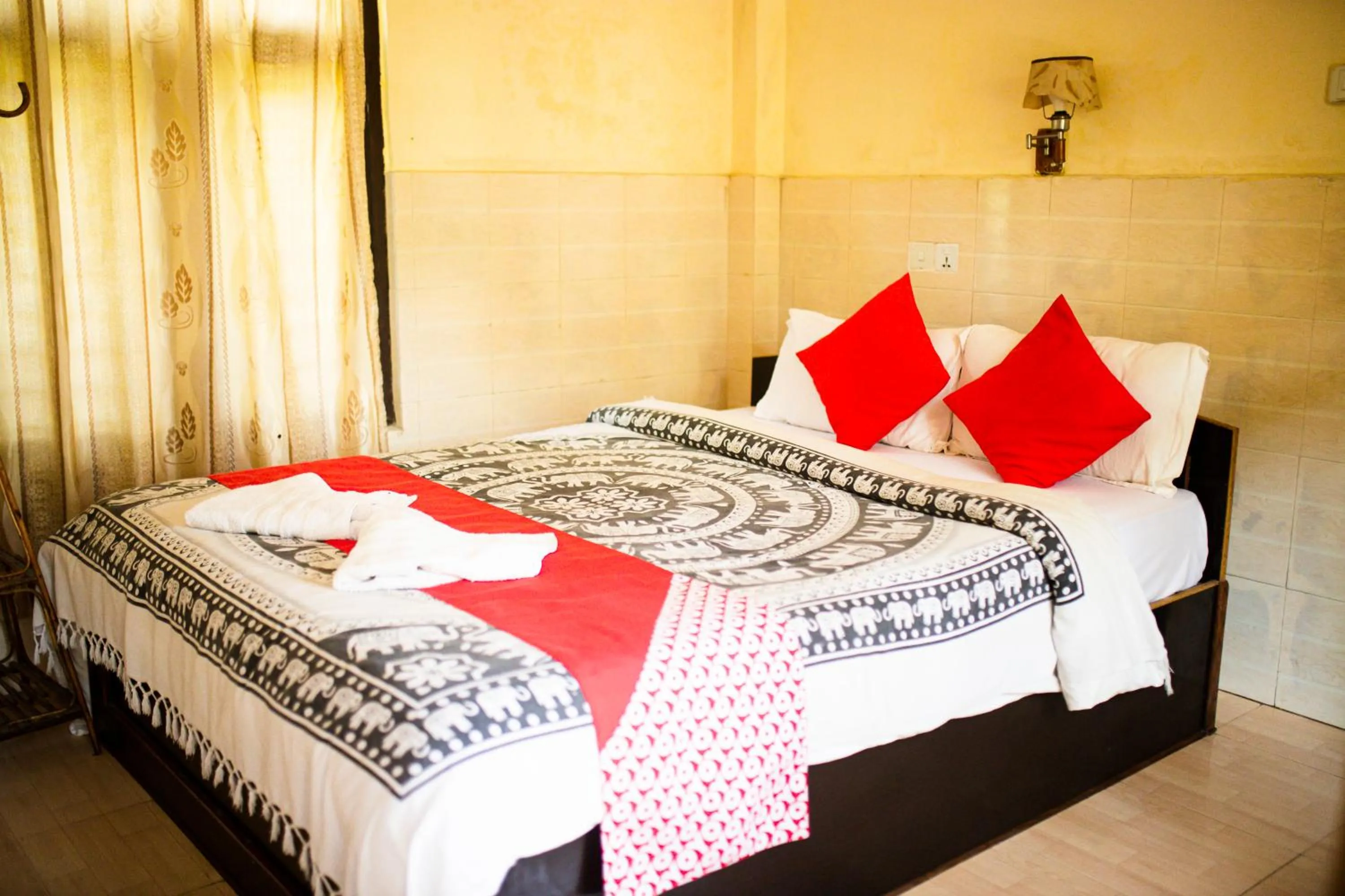 Bed in Chitwan Riverside Resort