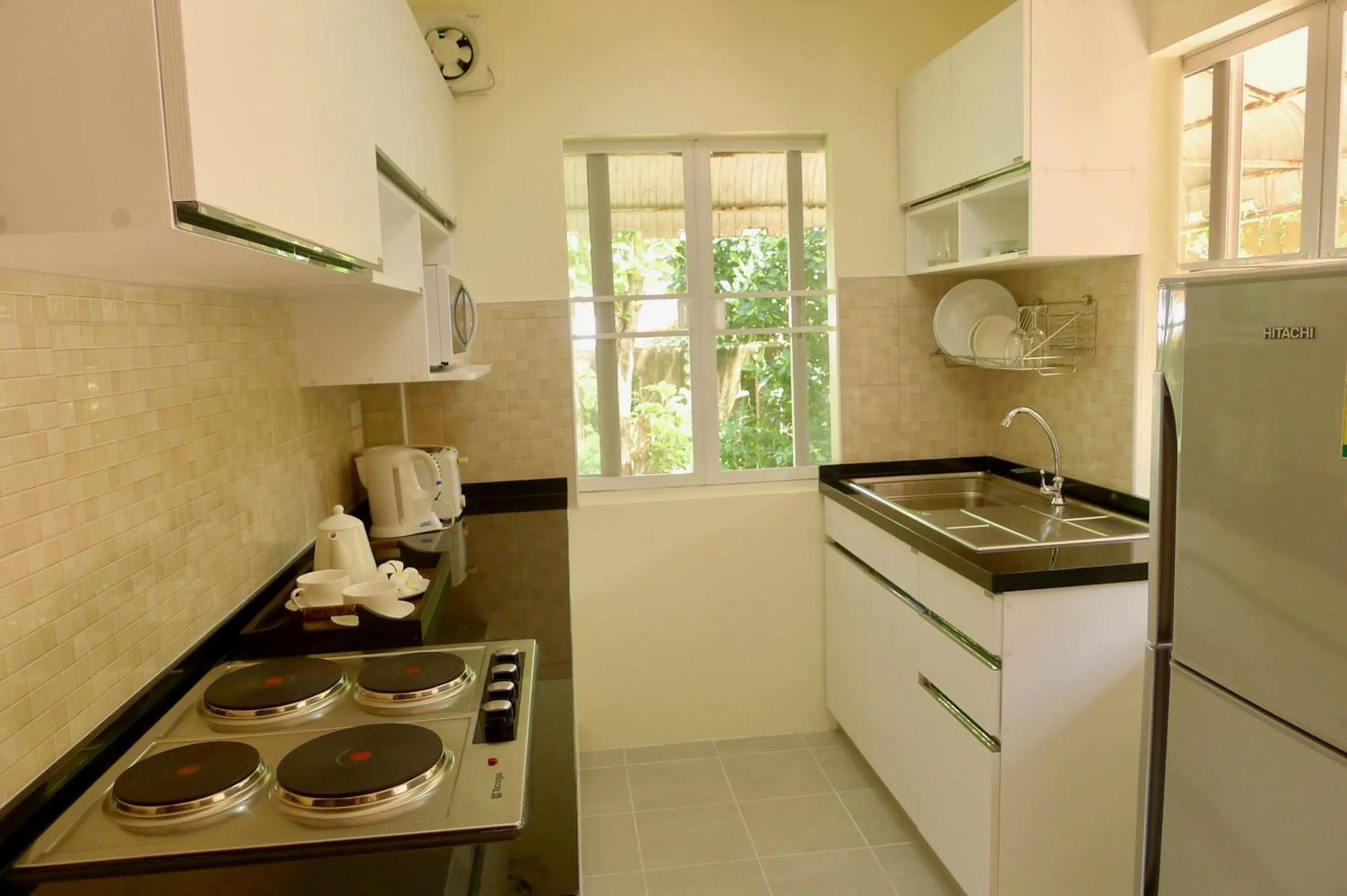 Kitchen or kitchenette in Symphony Villa