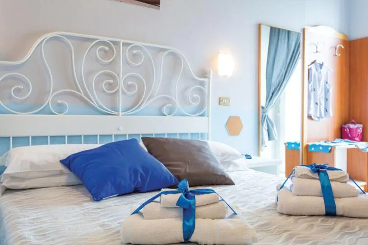 Bed in Hotel Tritone Rimini