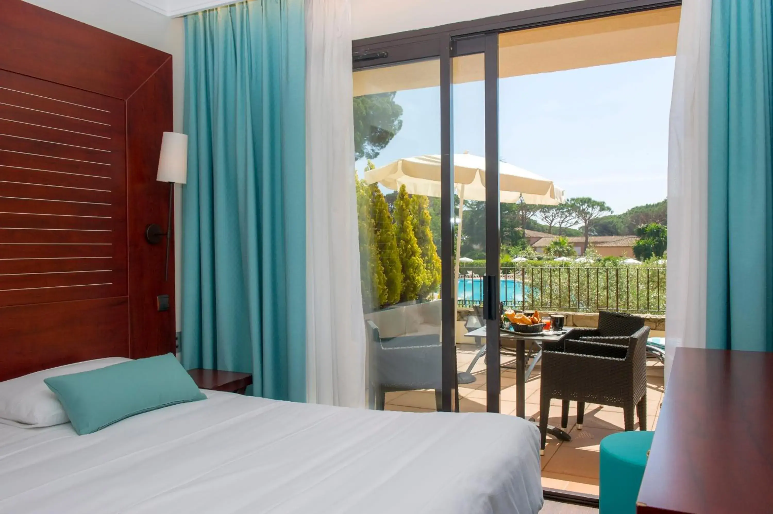 Balcony/Terrace, Bed in Hôtel Les Jardins De Sainte-Maxime Balcony/Terrace, Bed in Hôtel Les Jardins De Sainte-Maxime