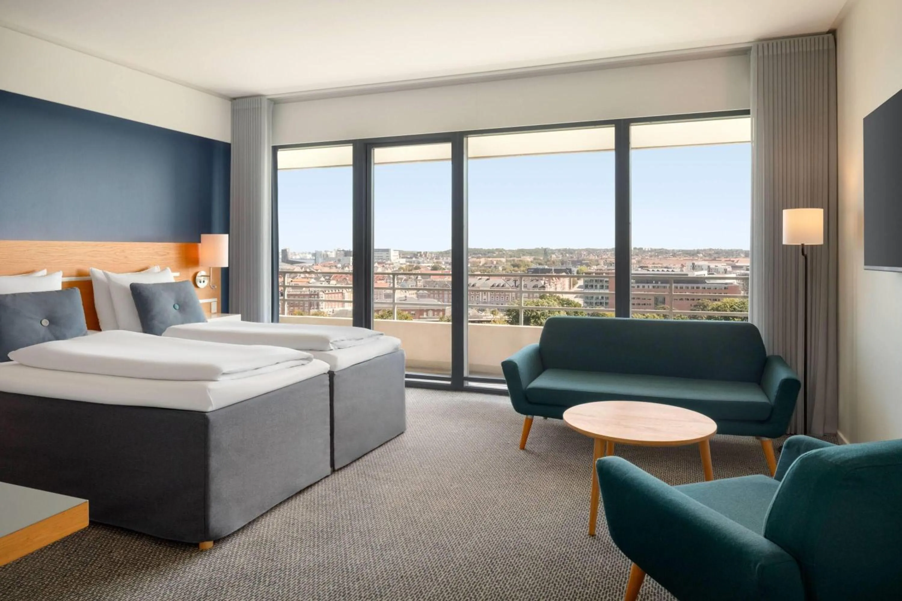 Photo of the whole room, Bed in Comwell Hvide Hus Aalborg, Dolce by Wyndham