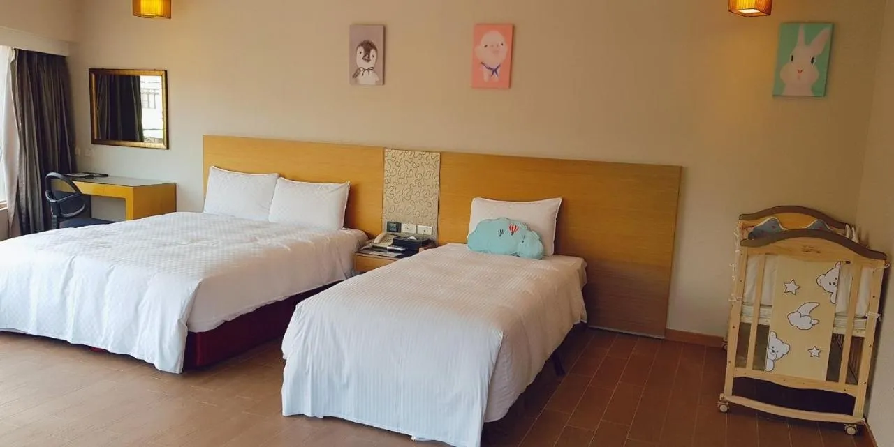 Bed in Esun Villa Hotel