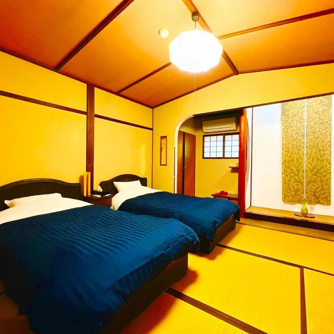 Bedroom, Bed in Japanese style hotel and dining Morigen