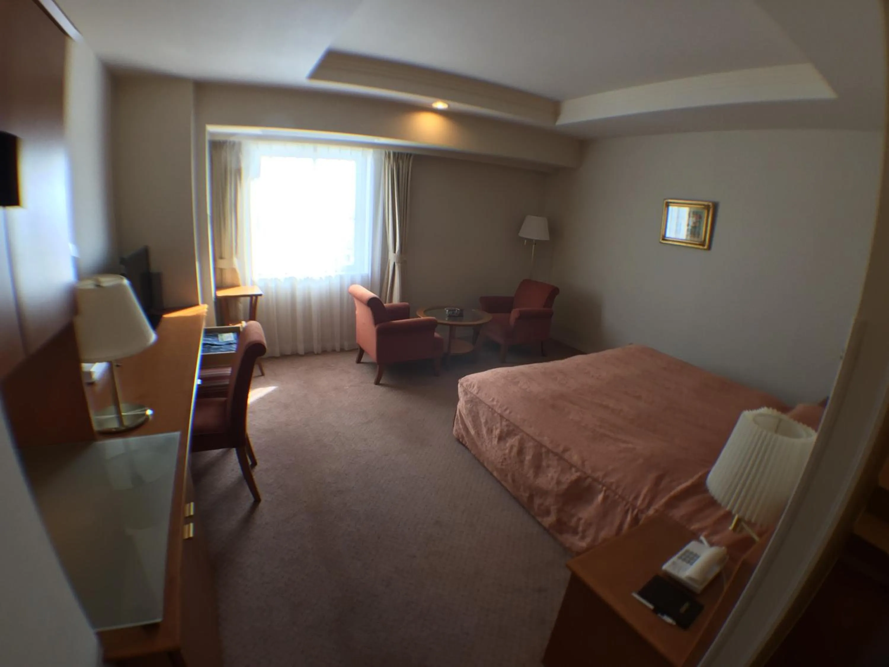 Living room, Bed in Hotel Okhotsk Palace