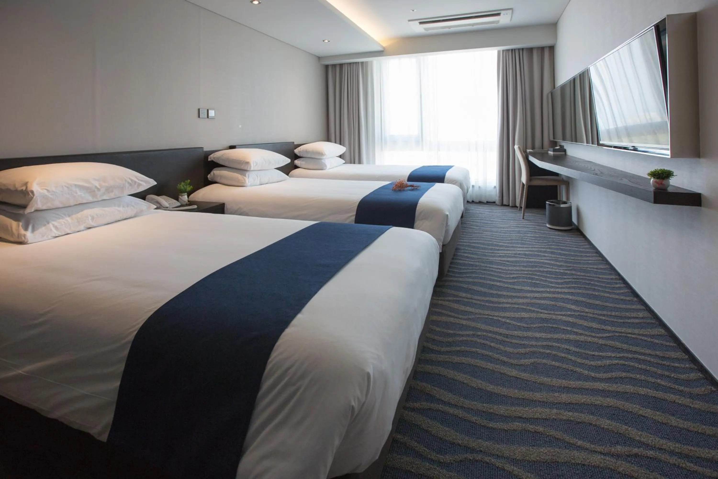 Bed in Gloucester Hotel Jeju