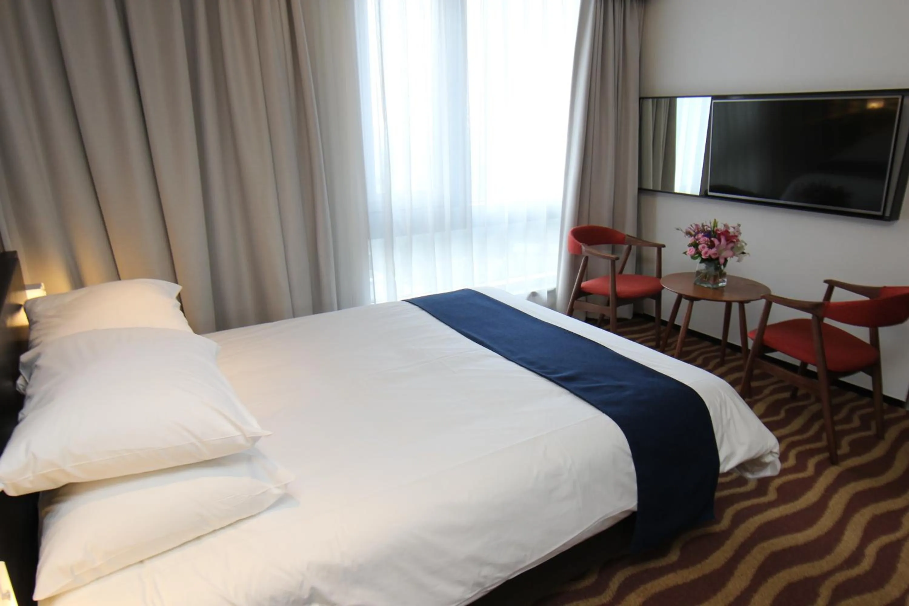 Bed in Gloucester Hotel Jeju