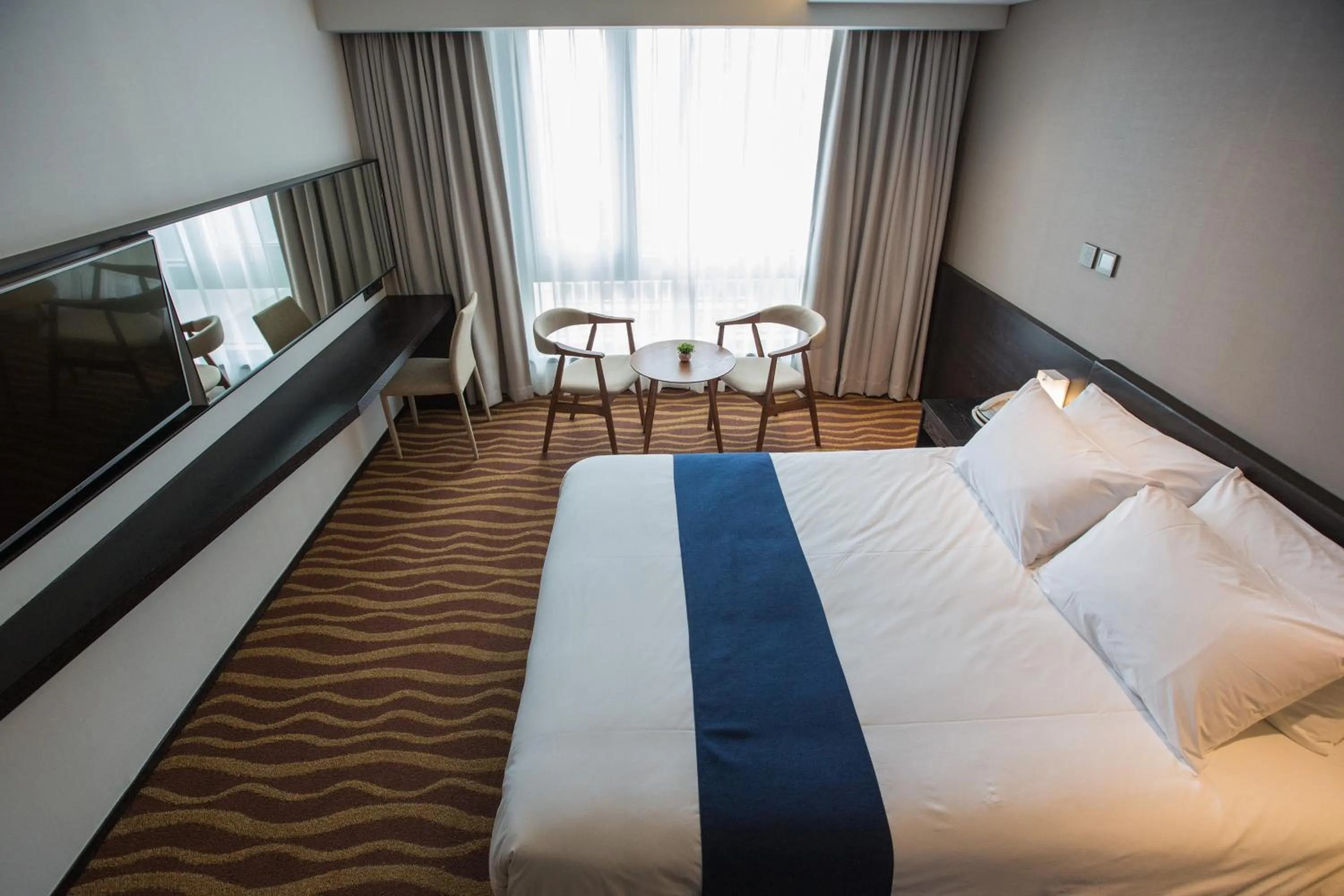 Bed in Gloucester Hotel Jeju