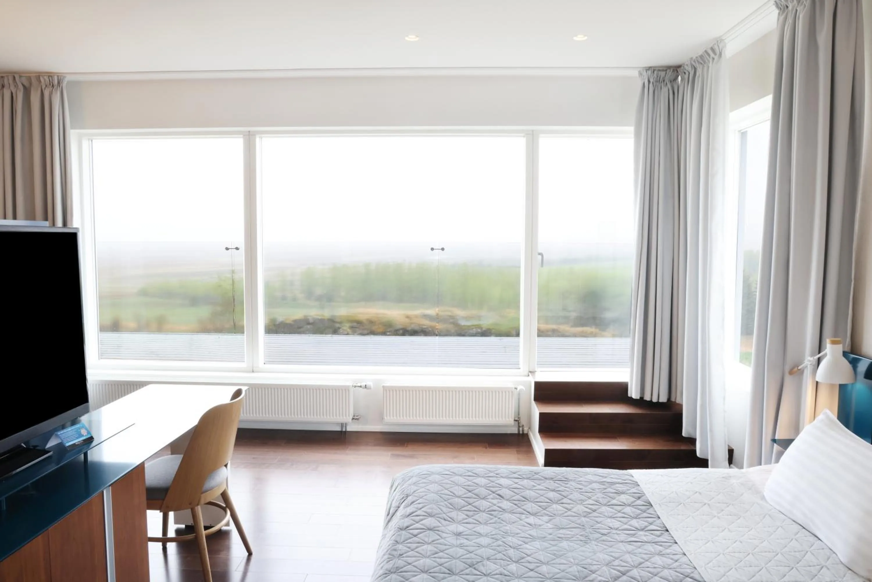 Communal lounge/ TV room, Bed in Fosshotel Vatnajökull